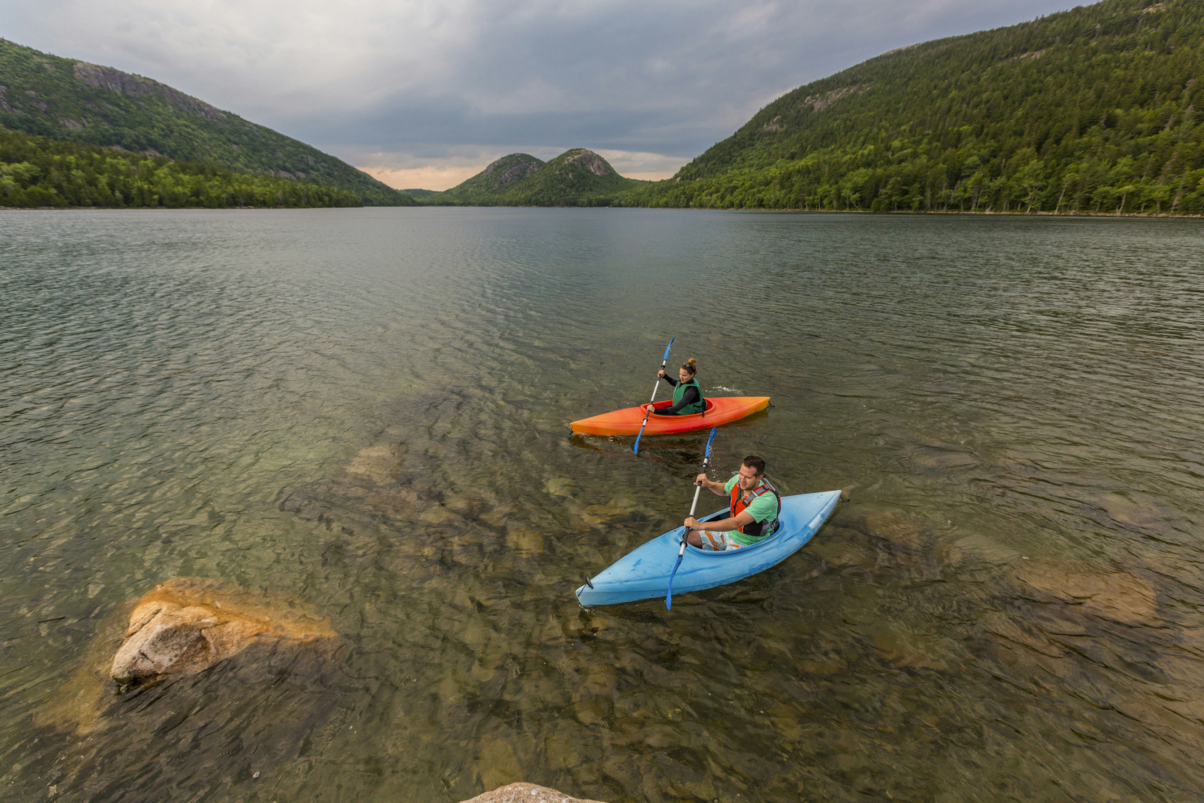 Couple kayaking on Jordan Pond in Acadia National Park, Maine, USA