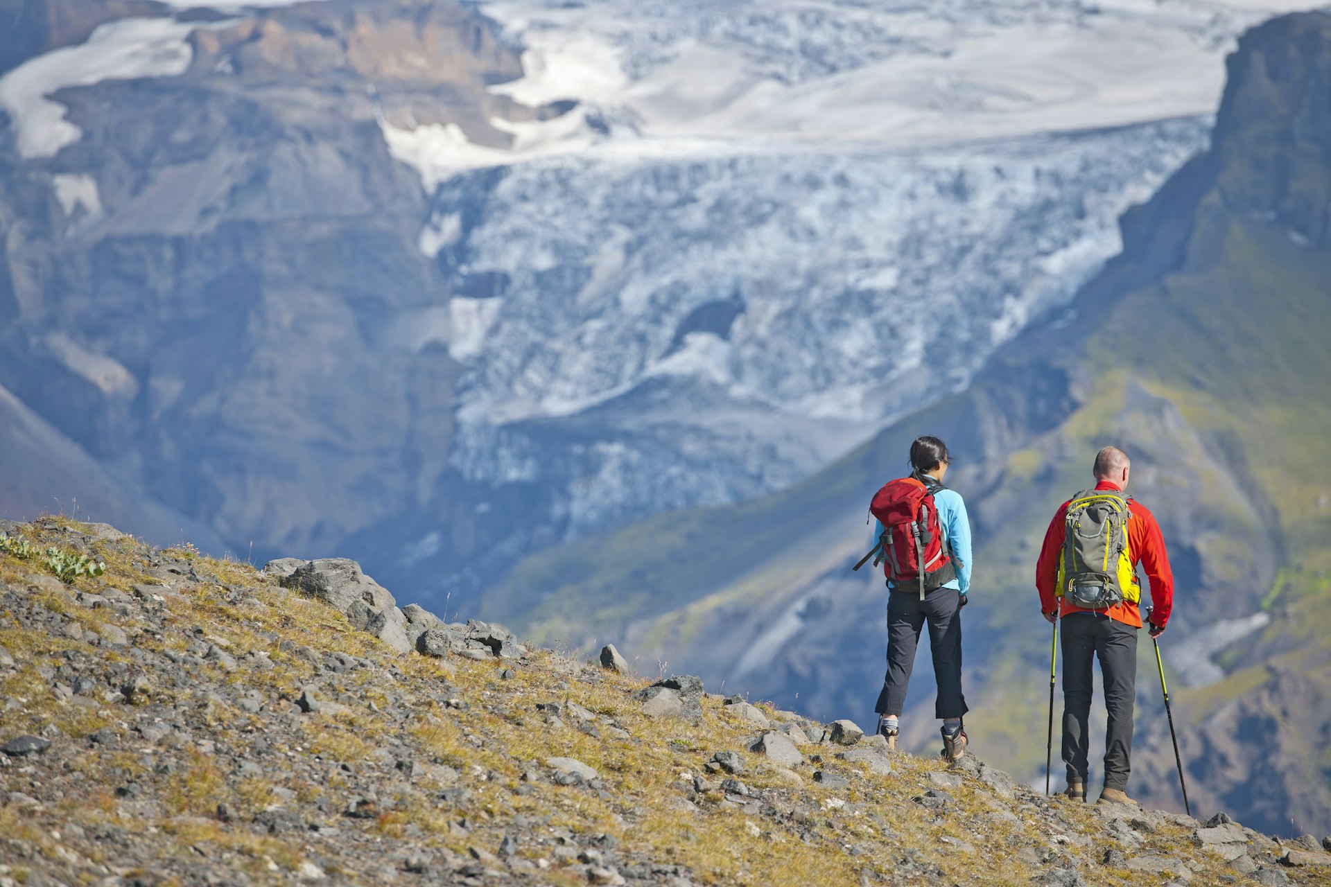 Couple hiking up to Fimmvordurhals Pass above Thorsmork Valley, Thorsmork, South Iceland, Iceland