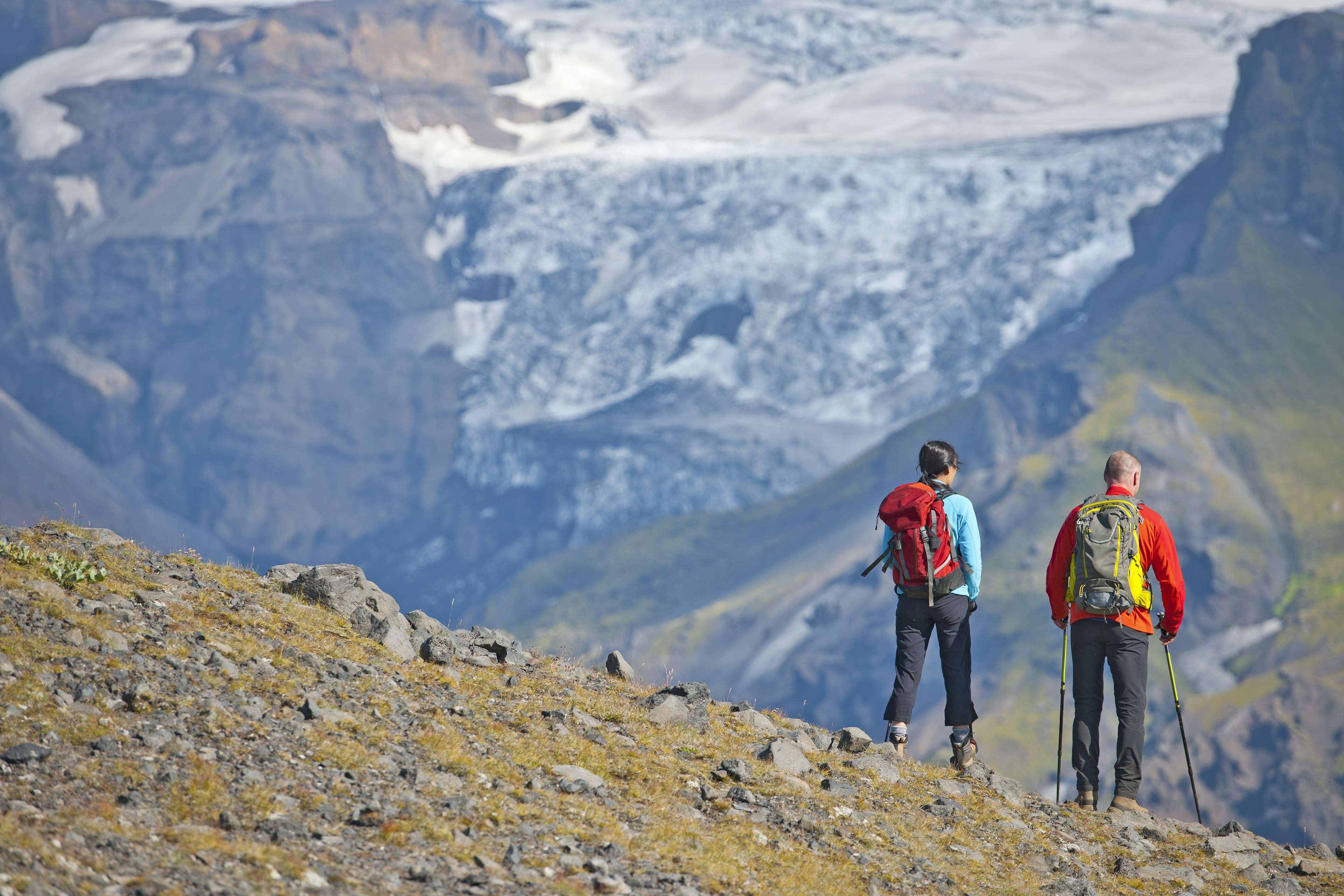 Couple hiking up to Fimmvordurhals Pass above Thorsmork Valley, Thorsmork, South Iceland, Iceland