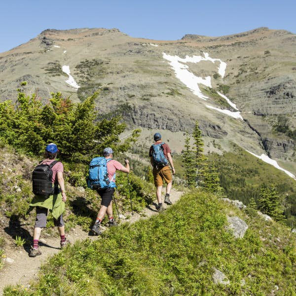 Hikers traveling along a trail in Montana