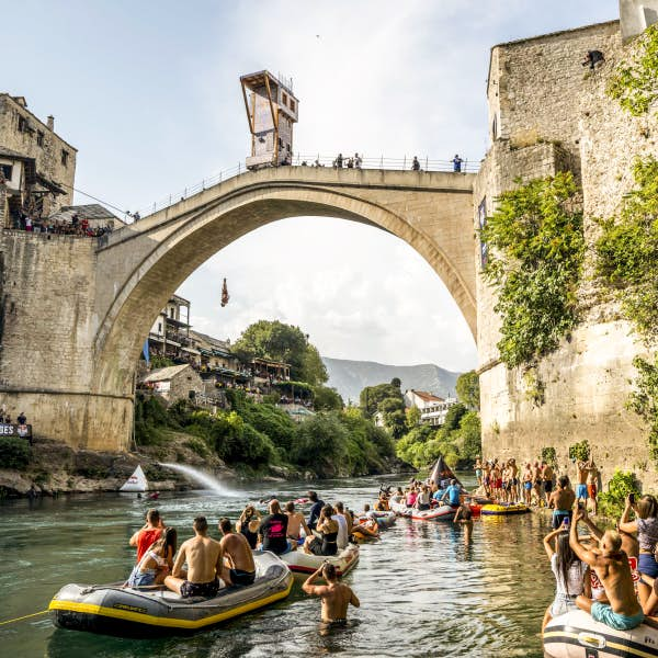 Divers jumping off Stari Most bridge in Mostar