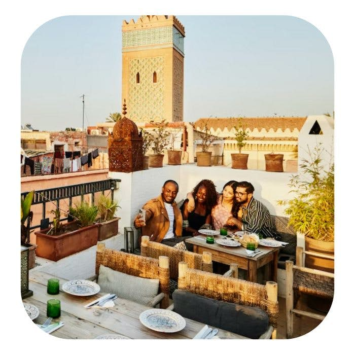 People sitting on a couch at a rooftop