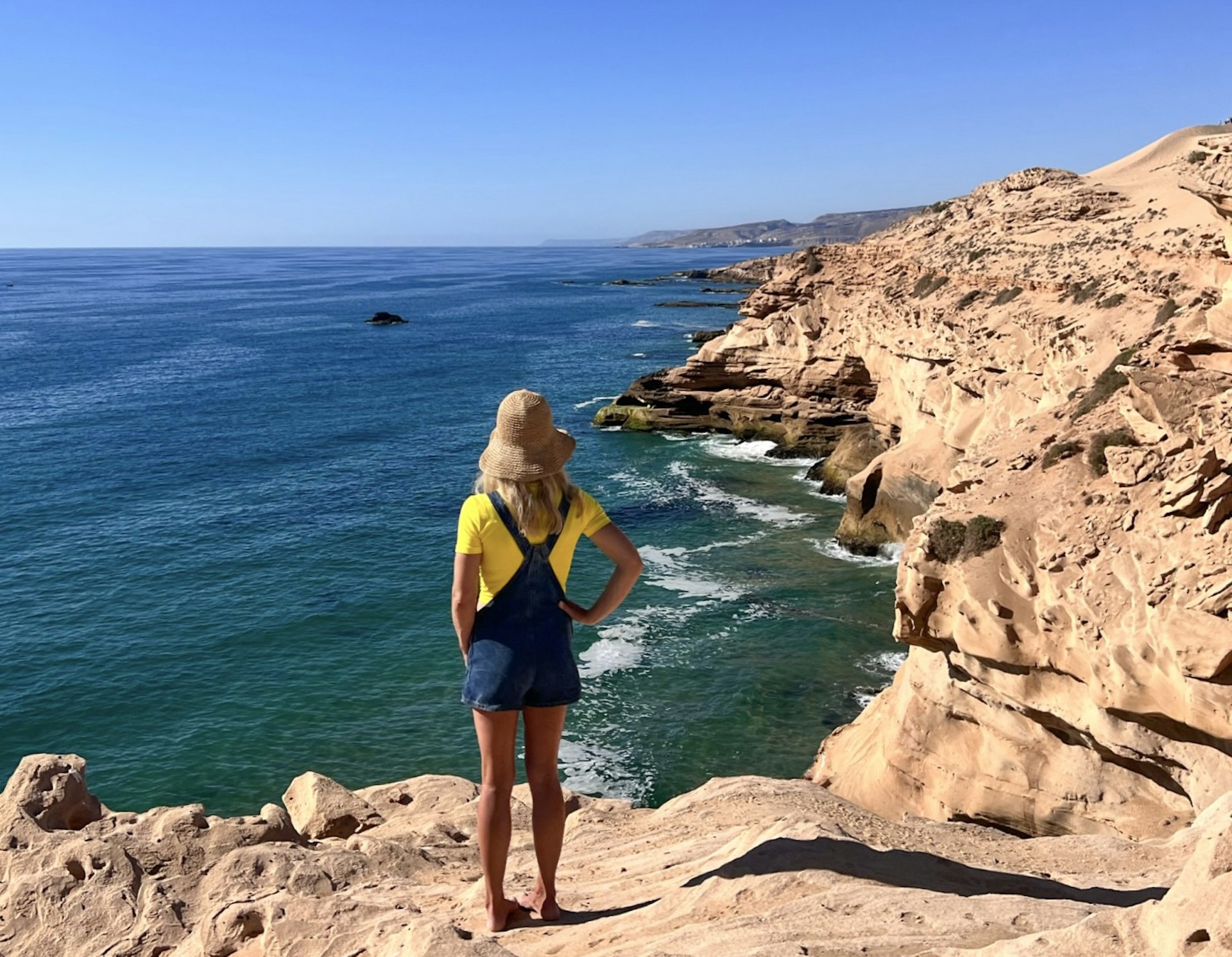 Sally Kirby in Tamri, Morocco, looking out over the rugged Atlantic coast.