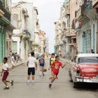 HAVANA-CUBA- DEC 5, 2018: Kids playing ball in the street in Centro Habana, one of the 15 municipalities or boroughs in the city of Havana, Cuba.; Shutterstock ID 1259537440; full: 65050; gl: Lonely Planet Online Editorial; netsuite: Cuba with Kids; your: Brian Healy
1259537440
ancient, architecture, ball, balls, black, boy, building, car, centro, children, city, cityscape, colonial, competition, cuba, exterior, famous, field, football, friend, friendship, game, group, habana, havana, kid, kids, landmark, little, old, outdoor, park, people, person, play, player, soccer, sport, street, team, tourism, tourist, town, traditional, travel, urban, view, vintage, woman, young