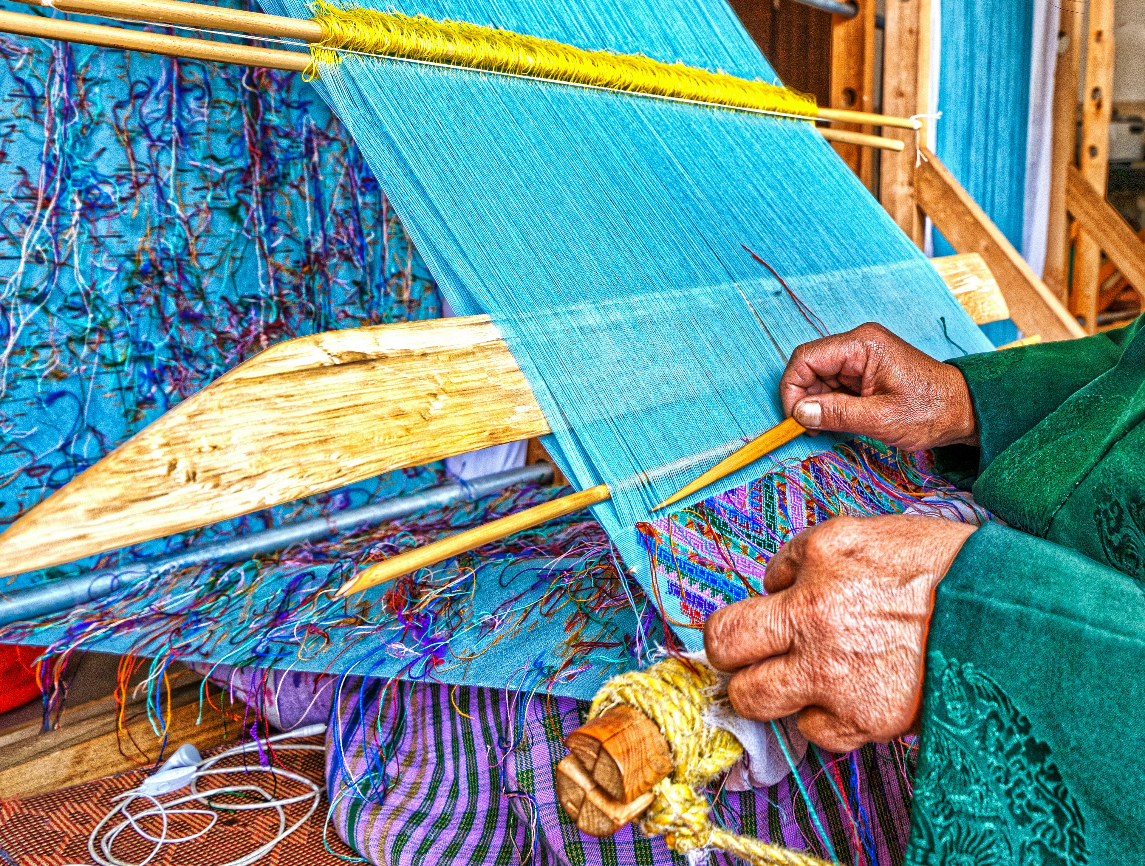 Hands of a woman weaving in Bhutan