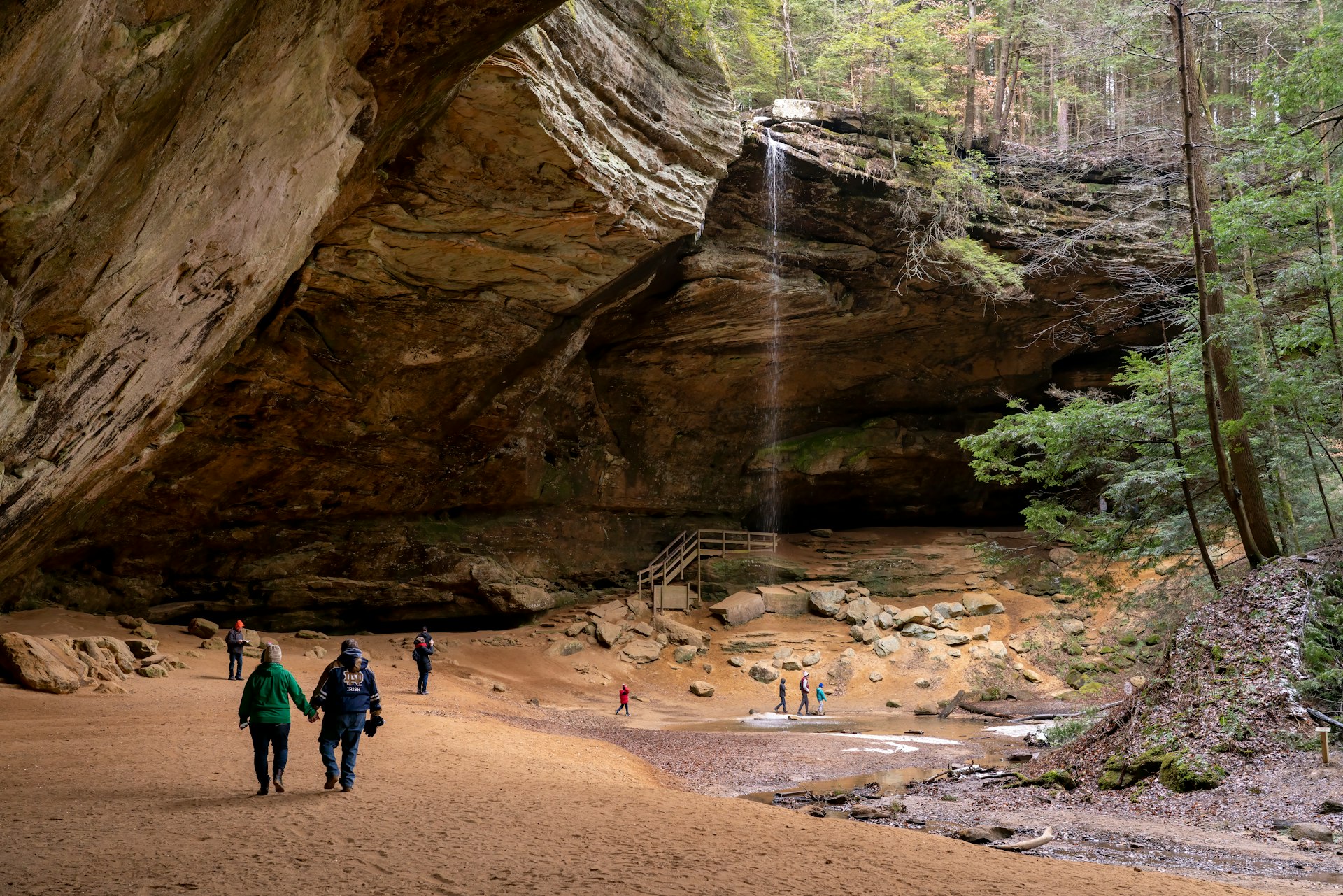 Tourists visit Ash Cave at Hocking Hills State Park, Ohio, USA