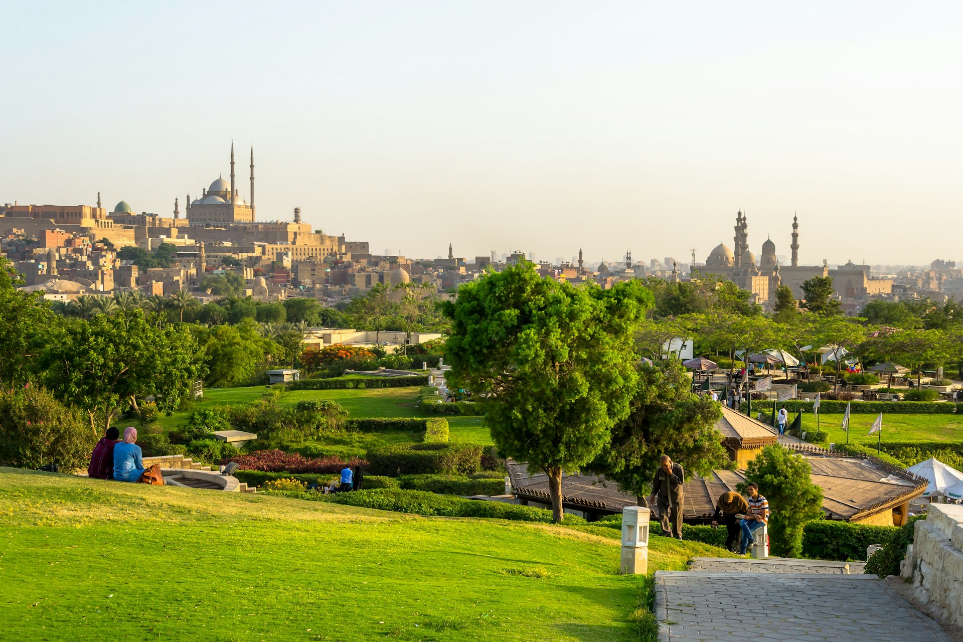 View of the Al-Azhar Park gardens. In the background is the Great Mosque of Muhammad Ali Pasha, a mosque situated in the Citadel of Cairo.
