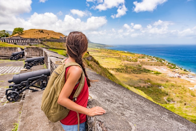 Tourist girl on St Kitts island cruise travel destination visiting Brimstone Hill Fortress National Park on vacation. Caribbean cruise ship woman walking on cannon lookout on summer holidays.
708875509