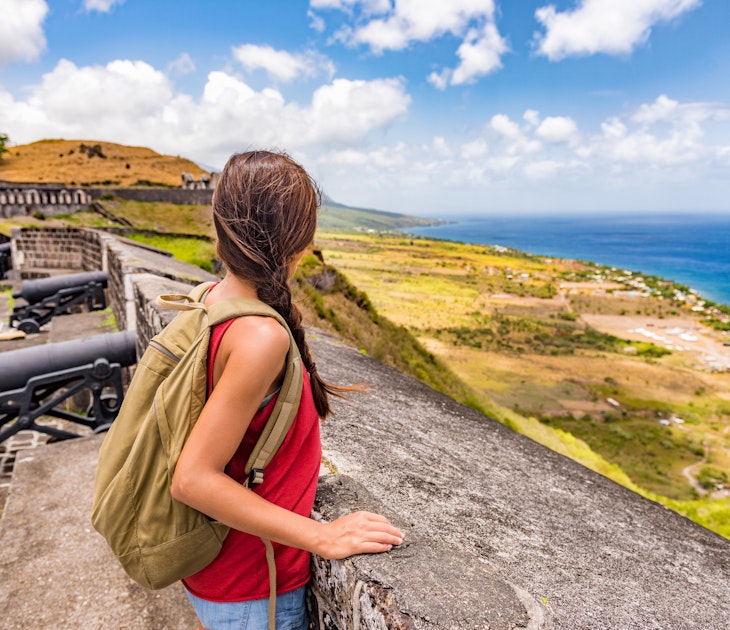 Tourist girl on St Kitts island cruise travel destination visiting Brimstone Hill Fortress National Park on vacation. Caribbean cruise ship woman walking on cannon lookout on summer holidays.
708875509