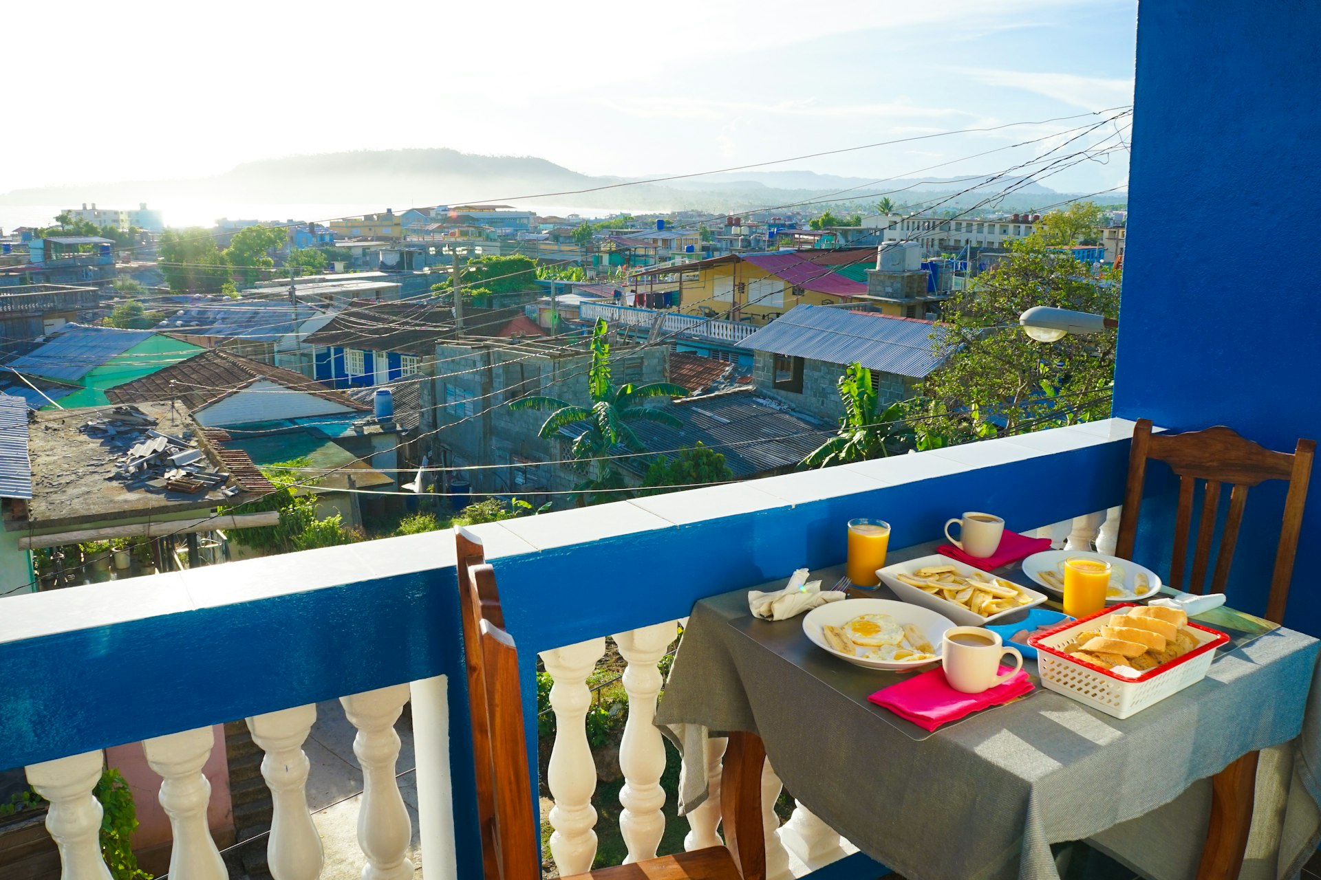 Breakfast is laid out on a table overlooking the Cuban city of Baracoa