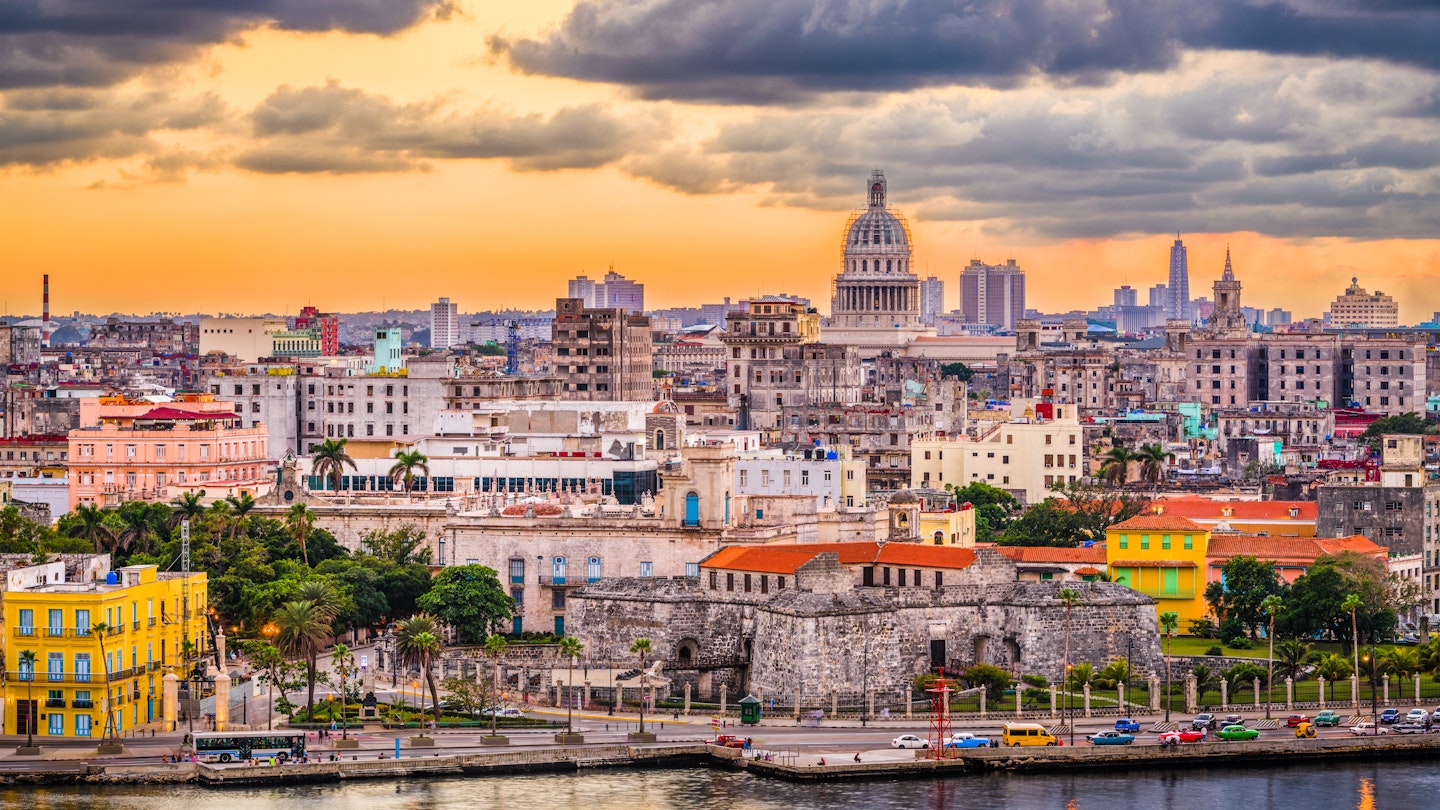 Downtown Havana skyline at dusk.
1020405811
architecture, building, buildings, business, capital, capitol, capitolio, caribbean, city, cityscape, cuba, cuban, dawn, district, dome, downtown, dusk, evening, famous, financial, government, habana, havana, historic, historical, hotels, landmark, landscape, location, malecon, monument, night, old, place, resorts, roof, rooftop, scene, scenery, scenic, skyline, spanish, sunset, tourism, tower, town, travel, twilight, urban, view