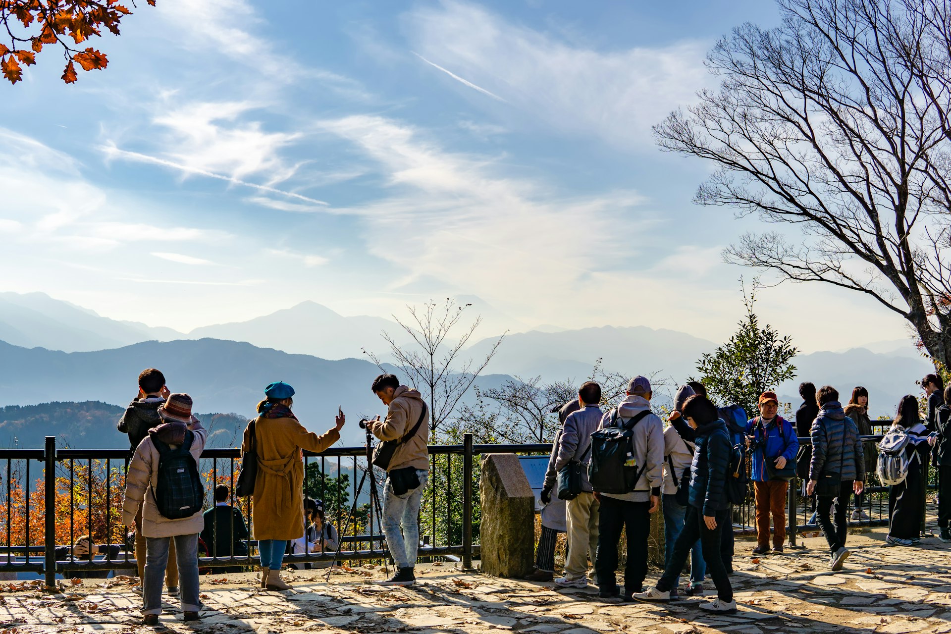  A crowd gathers at a Mount Fuji lookout point at the top of Mount Takao (Takao-San).