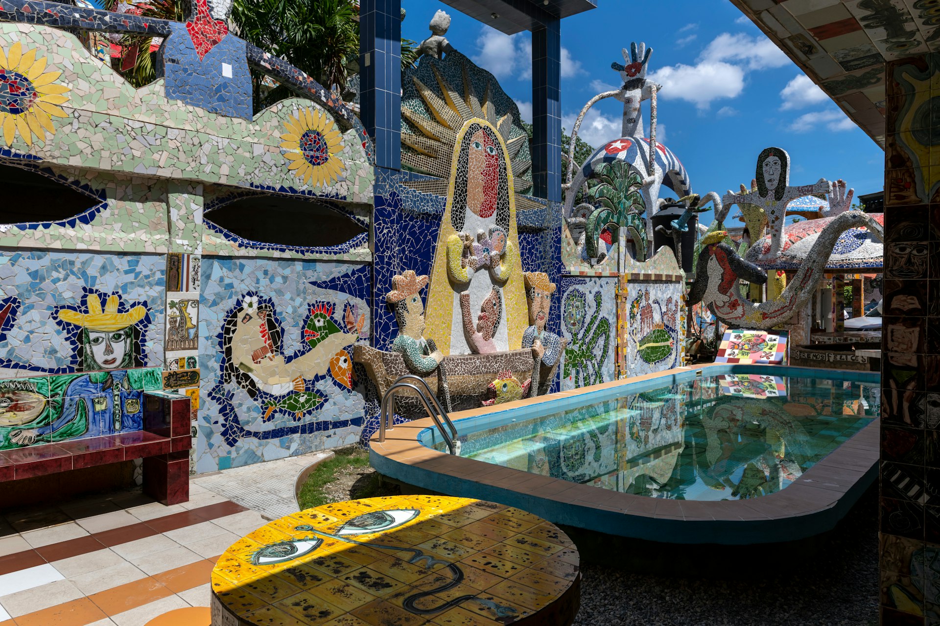 An outdoor pool area decorated with elaborate and colorful mosaic art in Jaimanitas, on the outskirts of Havana