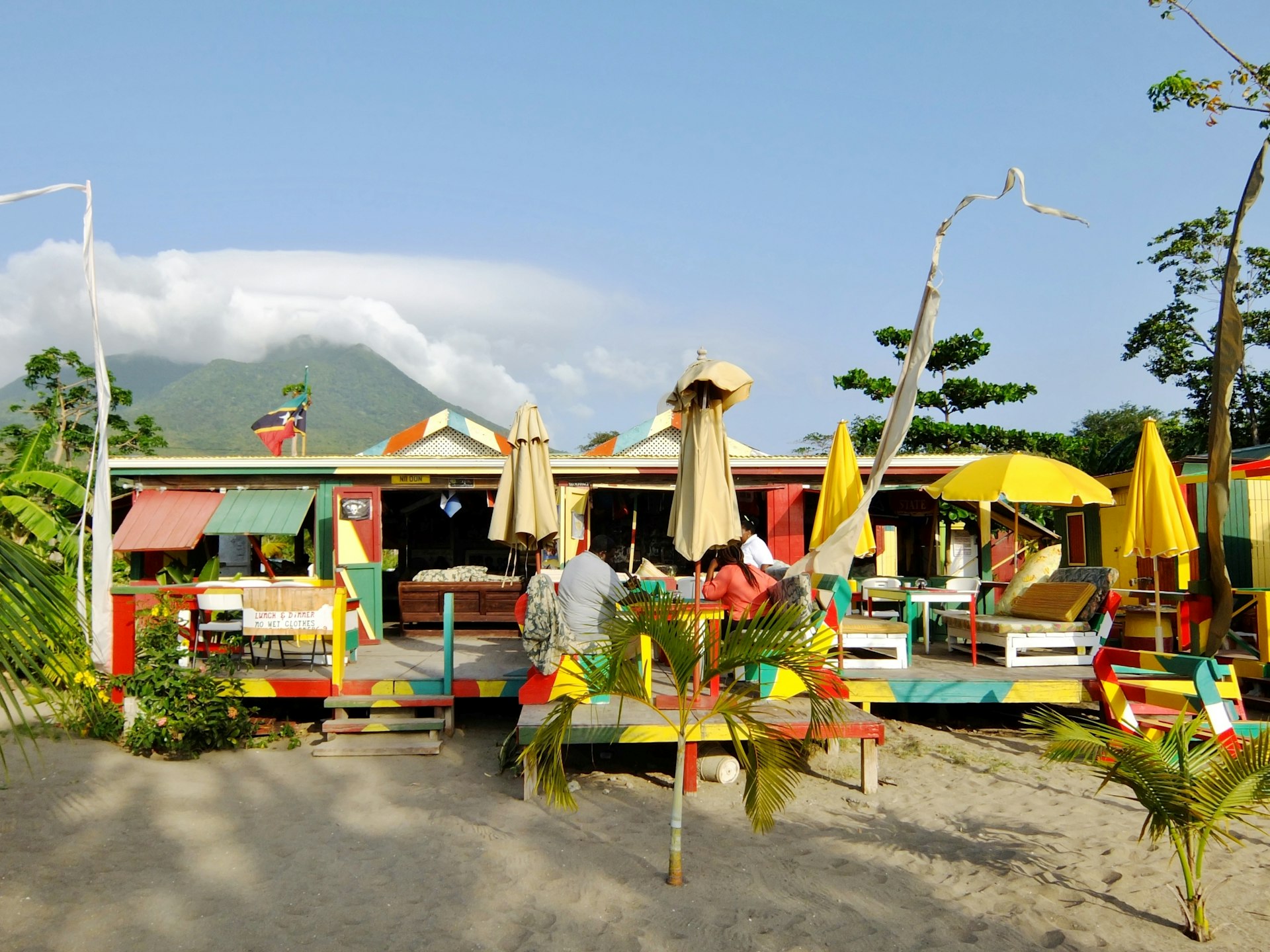 Sunshine's Beach Bar & Grill on Nevis, painted bright yellow, green and red