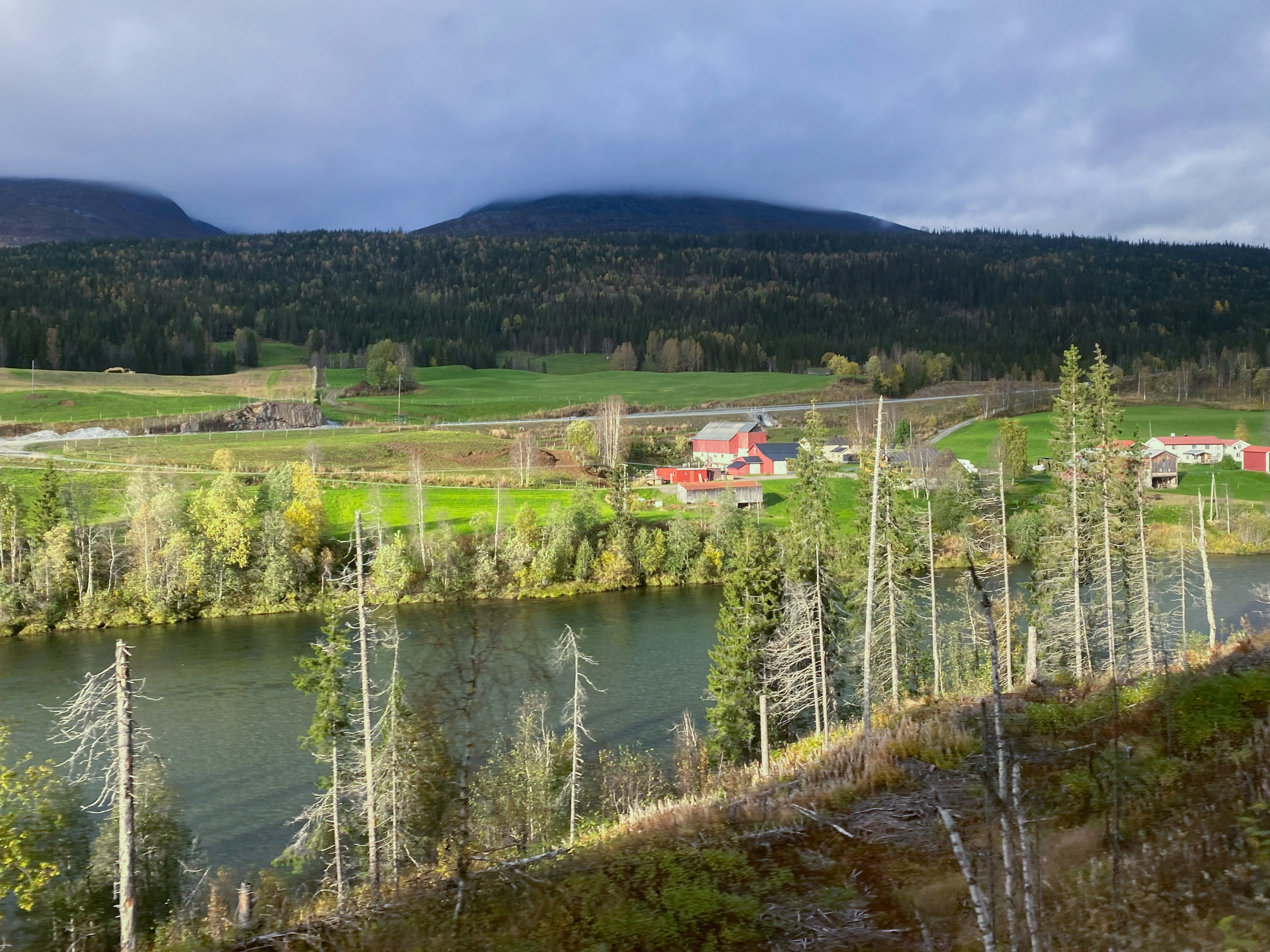 Lush green houses and colourful cabins dot the countryside of Bodo