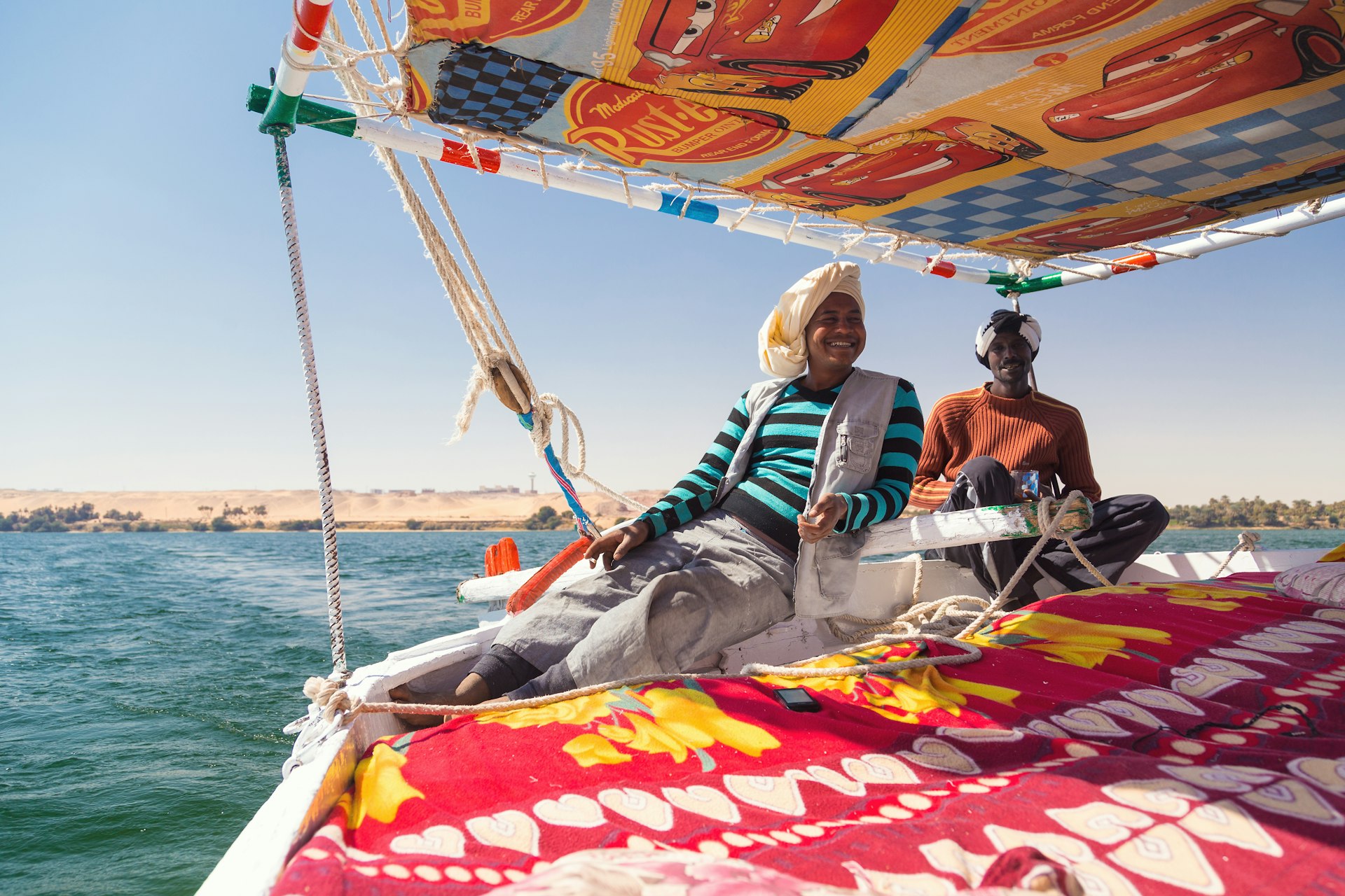 Nubian felucca sailing crew on trip on the Nile for tourists
