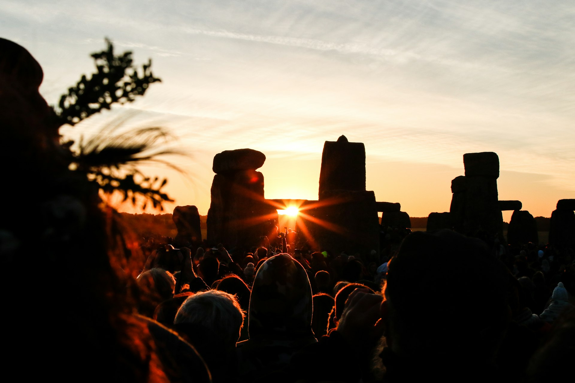 People gather to watch the summer solstice at dawn at Stonehenge