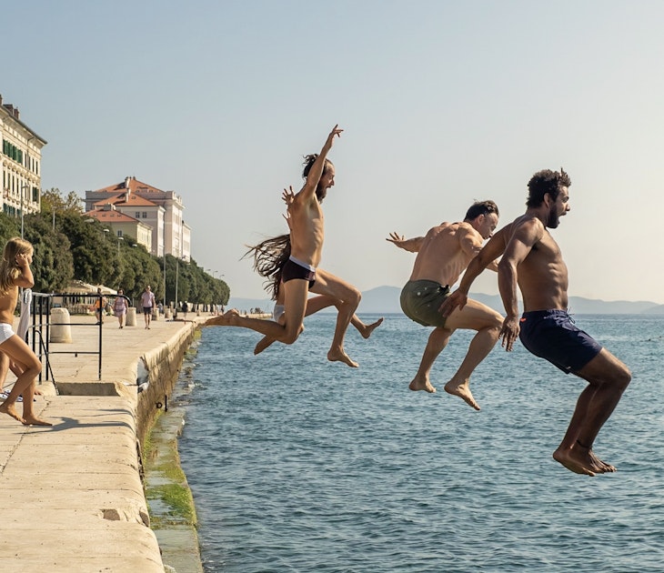 ZADAR, CROATIA - SEPTEMBER 2018. Group of courageous people jumping into harbour sea of Zadar, Croatia.
1064158618
Getty,  RFC,  action,  active,  adriatic,  children,  diving,  extreme,  fearless,  free,  friends,  group,  happy,  high,  holiday,  jump,  kids,  lifestyle,  man,  mediterranean,  ocean,  outdoor,  overcome,  person,  recreation,  scary,  swim,  vacation,  young,  multi ethnic,  Adult,  City,  Male,  Man,  Path,  People,  Person,  Photography,  Portrait,  Shorts,  Summer,  Swimwear,  Water,  Waterfront
