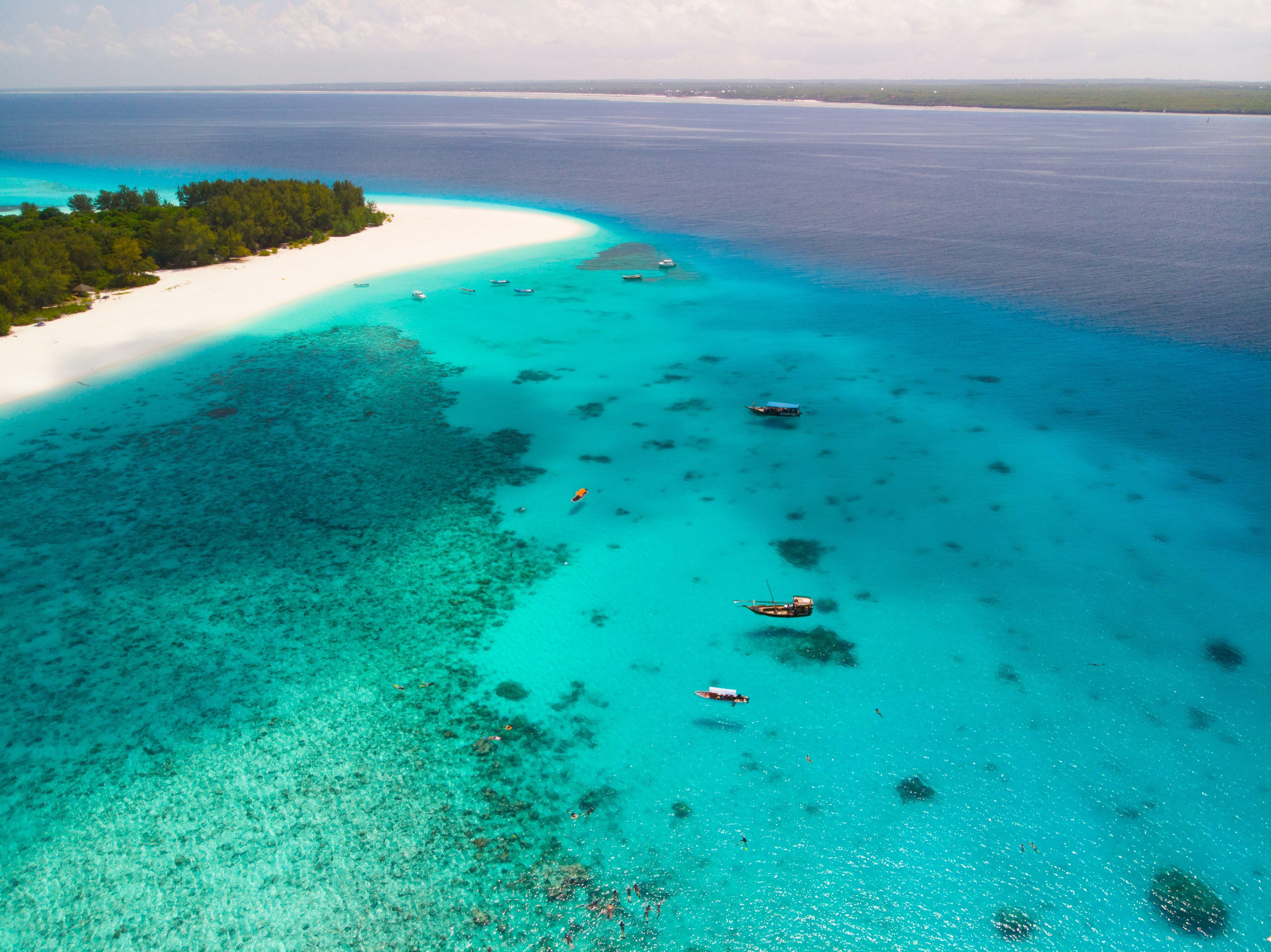 White sand beach on Mnemba Island, Zanziba and a bright blue sea