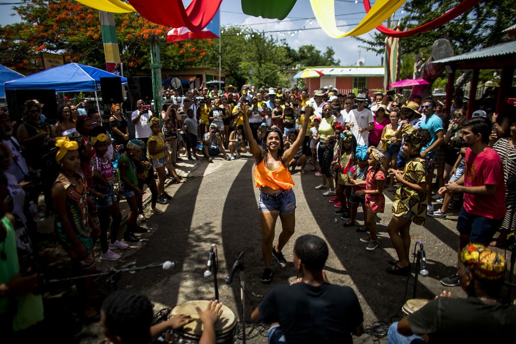A dancer surrounded by a crowd during a festival in Puerto Rico.