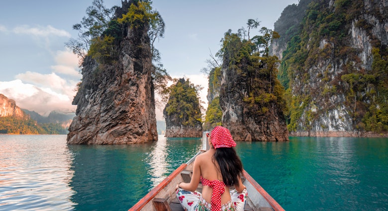 Asia Travel Thailand. Tourists in red bikini sets are holding hands with fun on the boat at Khao Sok National Park, Chiewlarn Dam, Thailand. Chiao Lan Khao Sok Dam is a tourist attraction in Surat Thani Province of Thailand.Happy woman traveler on boat her arms open feeling freedom, Ratchaprapa dam in KHAO SOK National Park, Thailand, Surat thani,Travel in Thailand, Beautiful destination Asia, Summer holiday outdoors vacation trip
1273413451