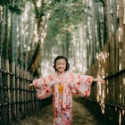 Happy young girl in kimono in bamboo forest, Japan
1369674947