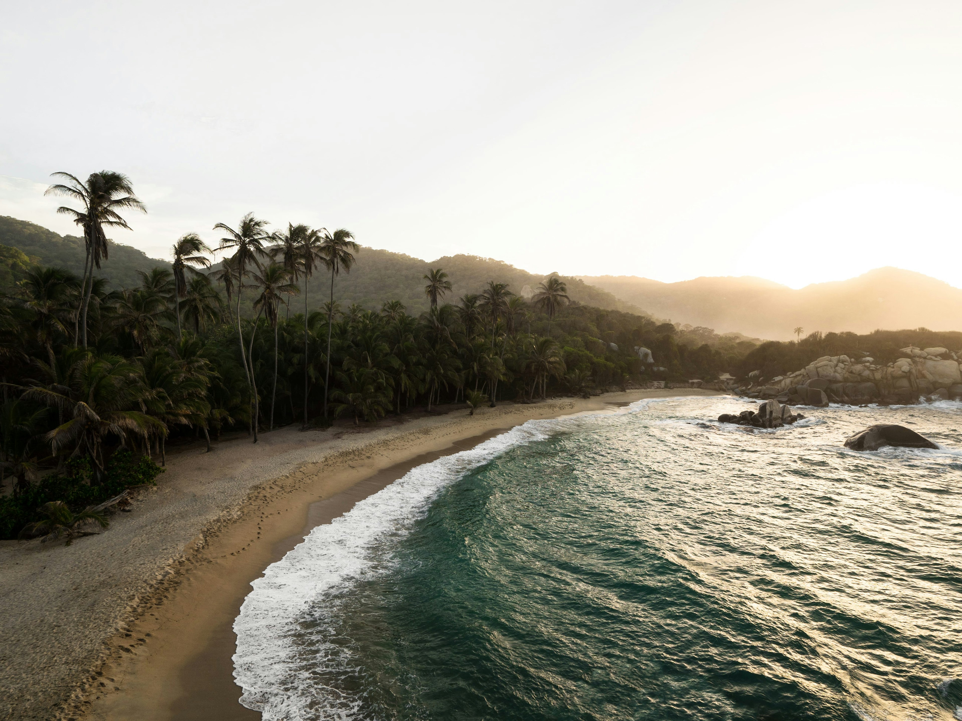 Aerial panorama view of Cabo San Juan del Guia in Tayrona National Park tropical Caribbean coast palm sand beach Colombia South America