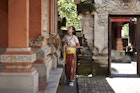 Young female tourist with camera exploring Balinese temple during vacation
1470432978
