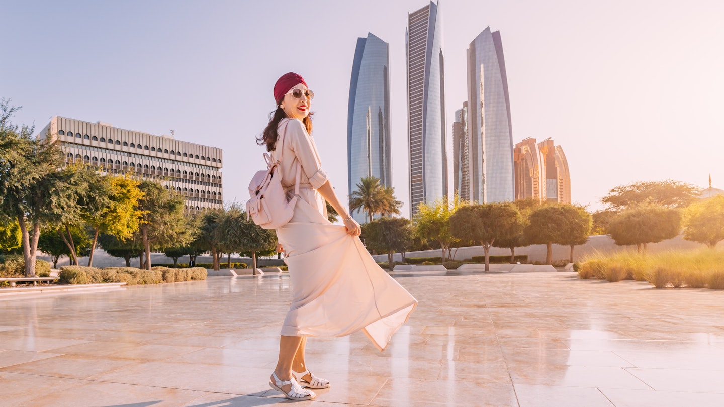Experience the fusion of modernity and tradition as an Indian woman walks against the backdrop of Abu Dhabi's iconic skyscrapers.
1487672966
girl, walk, real, estate, destination, trip, indian, arab
A woman walking across a plaza outdoors in Abu Dhabi with high-rise buildings in the background