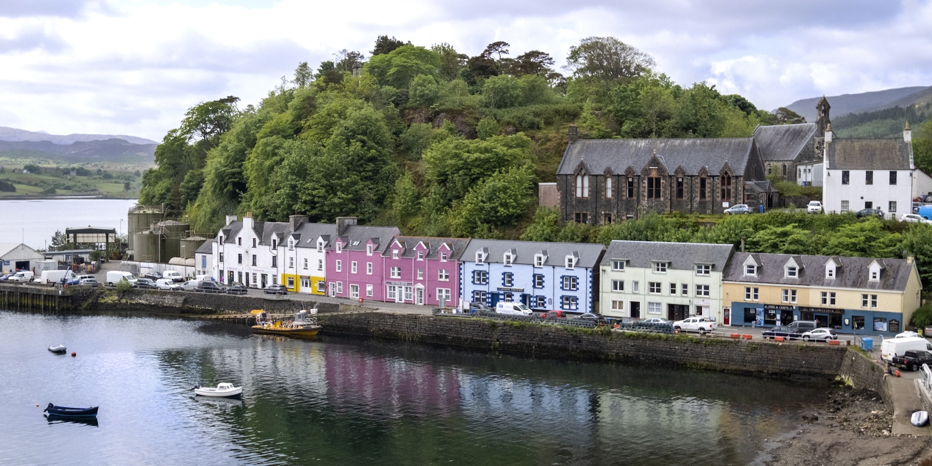 Scenic view looking out over the colorful village of Portree, capital of the Isle of Skye on a beautiful spring day.