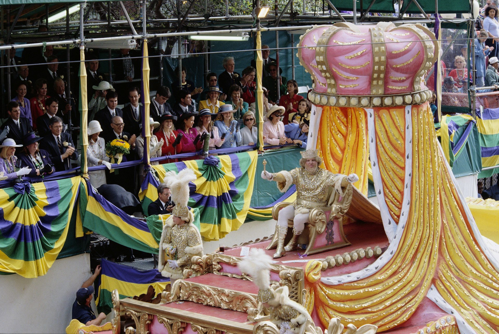 Mardi Gras parade float with Rex, King of Carnival, waving to the crowd in New Orleans, USA