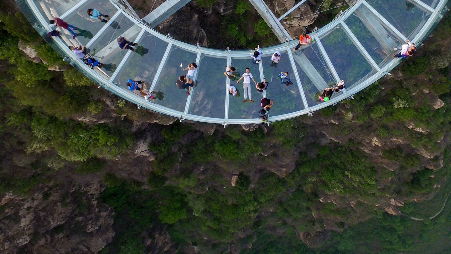 This photo taken on April 30, 2016 shows a glass sightseeing platform in Shilinxia scenic spot in Pinggu District of Beijing. .The sightseeing platform, which hangs 32.8 meters out from the cliff, is claimed to be the largest glass sightseeing platform in the world. / AFP / STR / China OUT        (Photo credit should read STR/AFP via Getty Images)
528407070
Horizontal