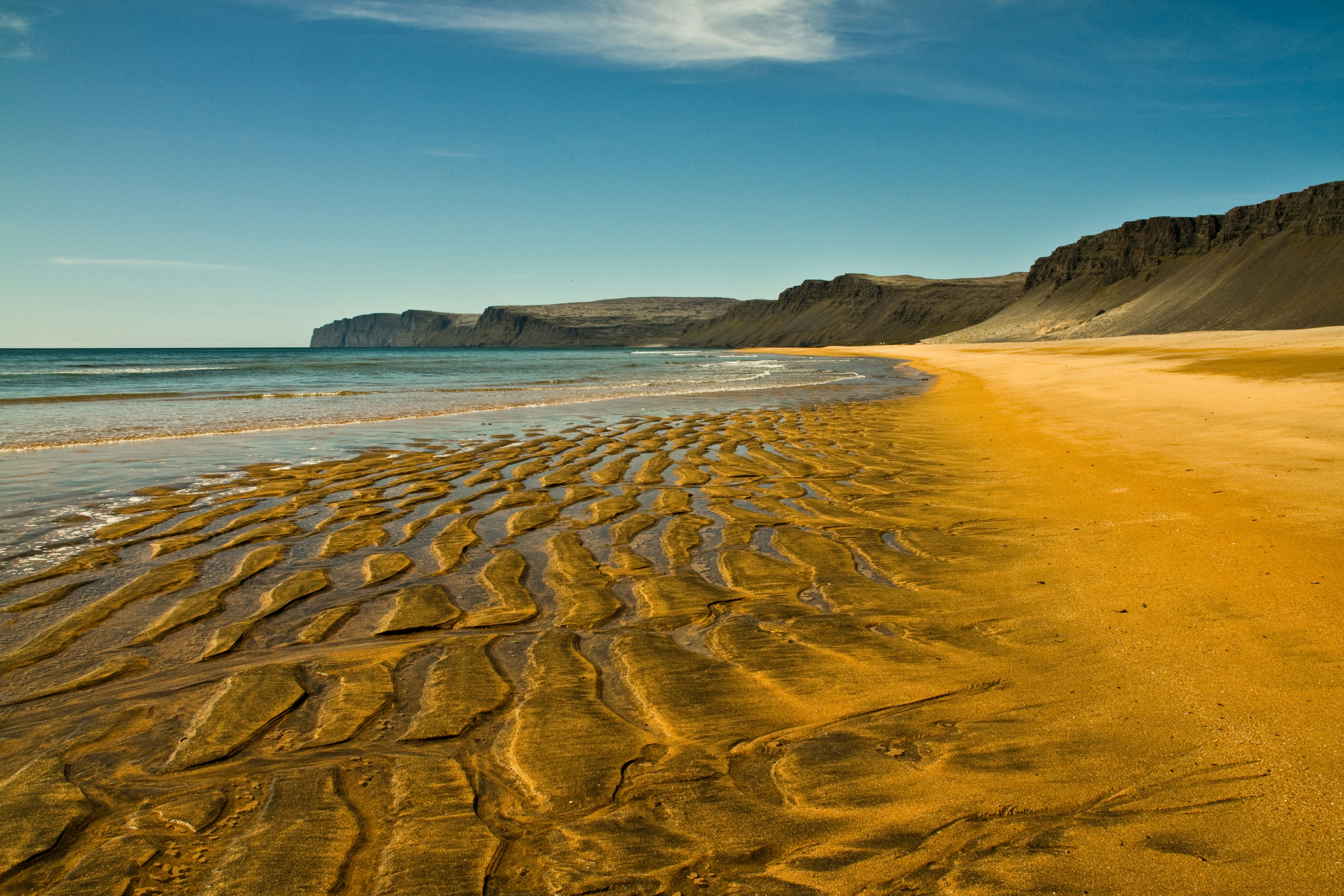 A golden beach in the Westfjords of Iceland.