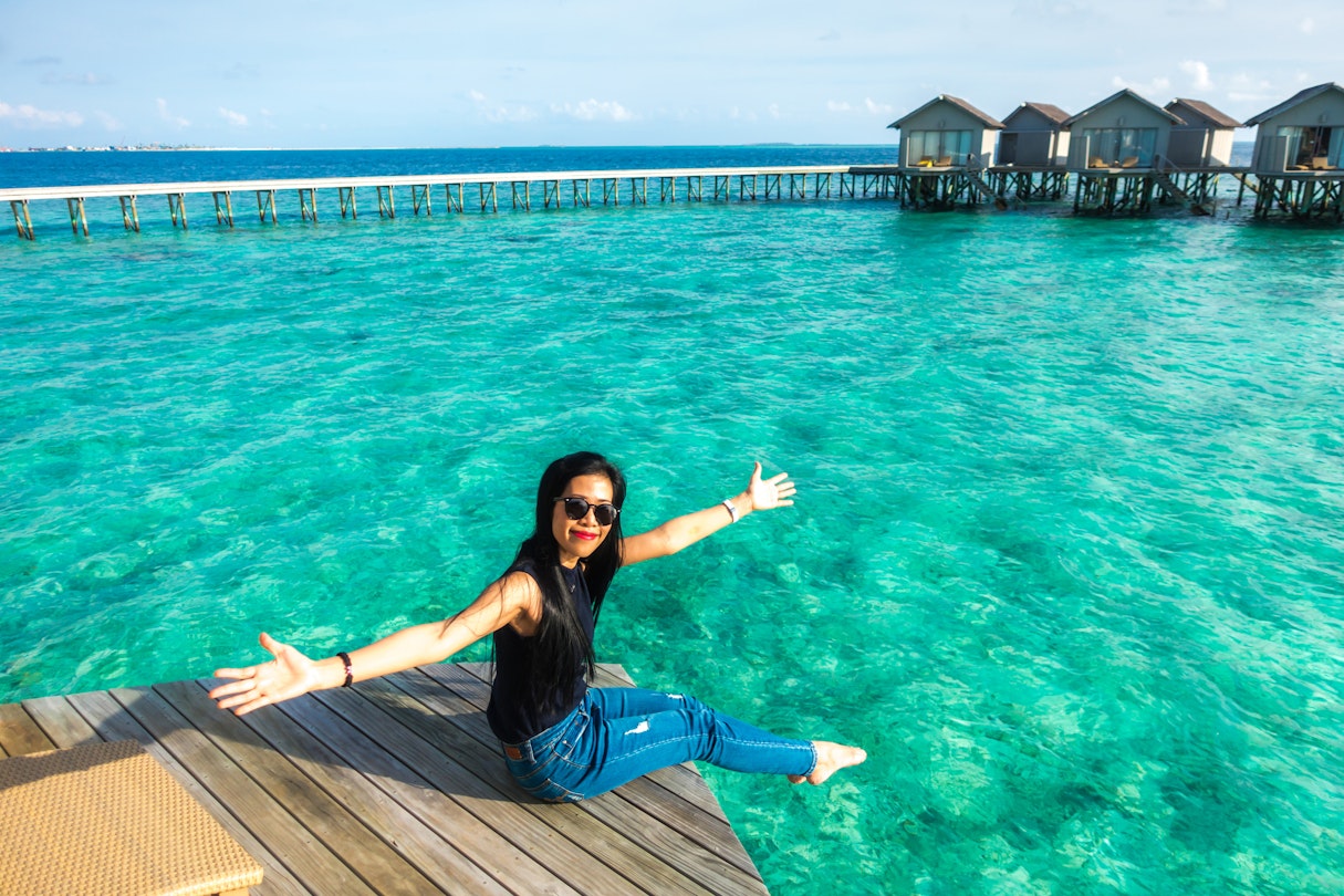 Portrait of Thai woman with overwater bungalows in Maldives
636159114
Thai Ethnicity, Bungalow, Young Women, Women, Females, Seascape, Adult, Smiling, Sitting, Asian Ethnicity, One Person, Relaxation, Blue, Turquoise Colored, Tropical Climate, Vacations, Nature, Outdoors, Full Length, People, Maldives, Day, Summer, Island, Beach, Sky, Indian Ocean, Sea, Hotel, Tourist Resort, Sunglasses