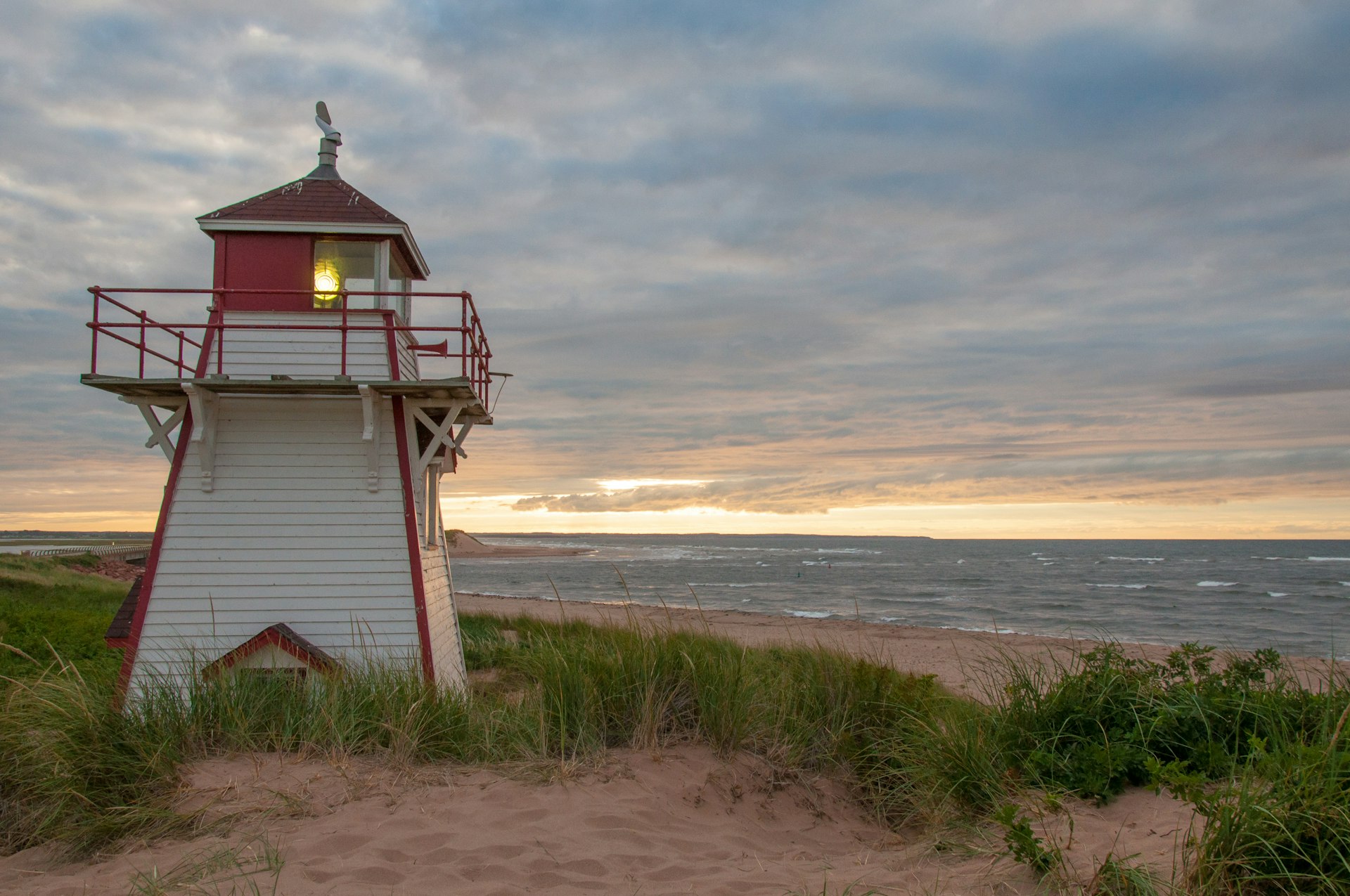 The sun sets behind the Covehead Lighthouse at Stanhope, Prince Edward Island