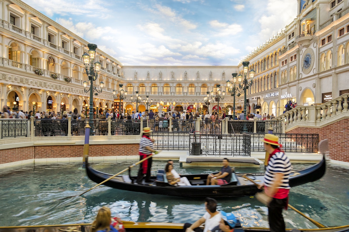View of Grand Canal Shoppes at the Venetian Resort Hotel and Casino, gondolier and tourists on gondolas are seen in the foreground, Las Vegas, Nevada, USA
851155566