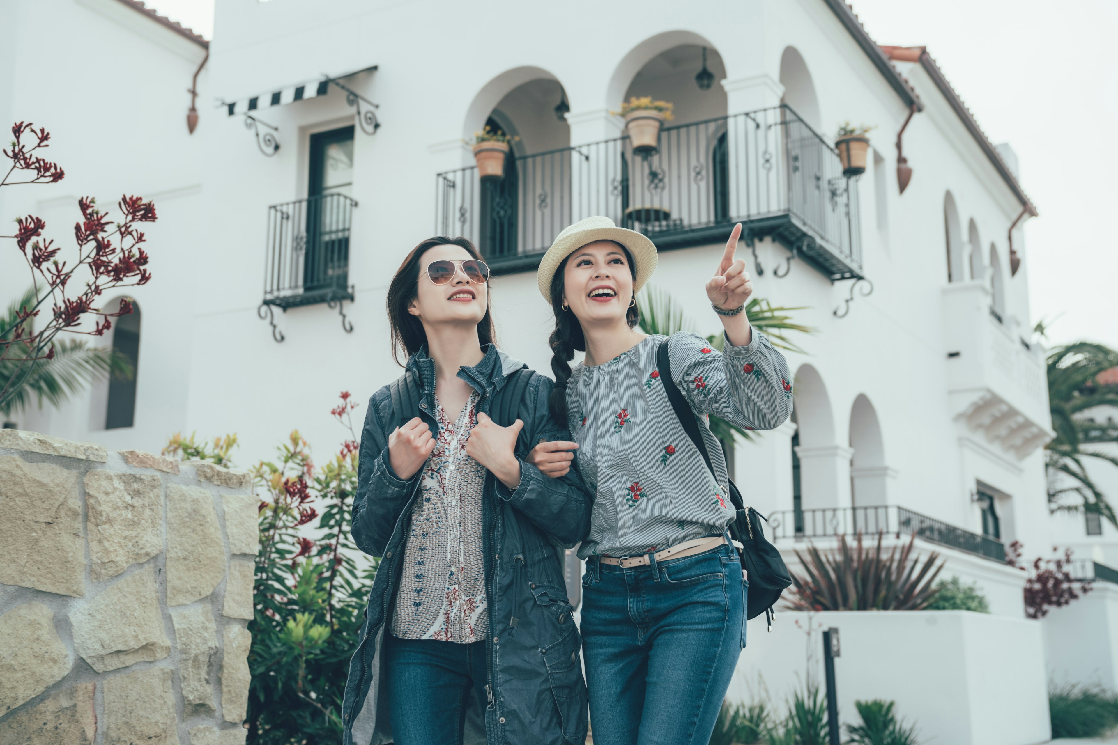 Women friends on holiday are sightseeing in Stearns Wharf in Santa Barbara.