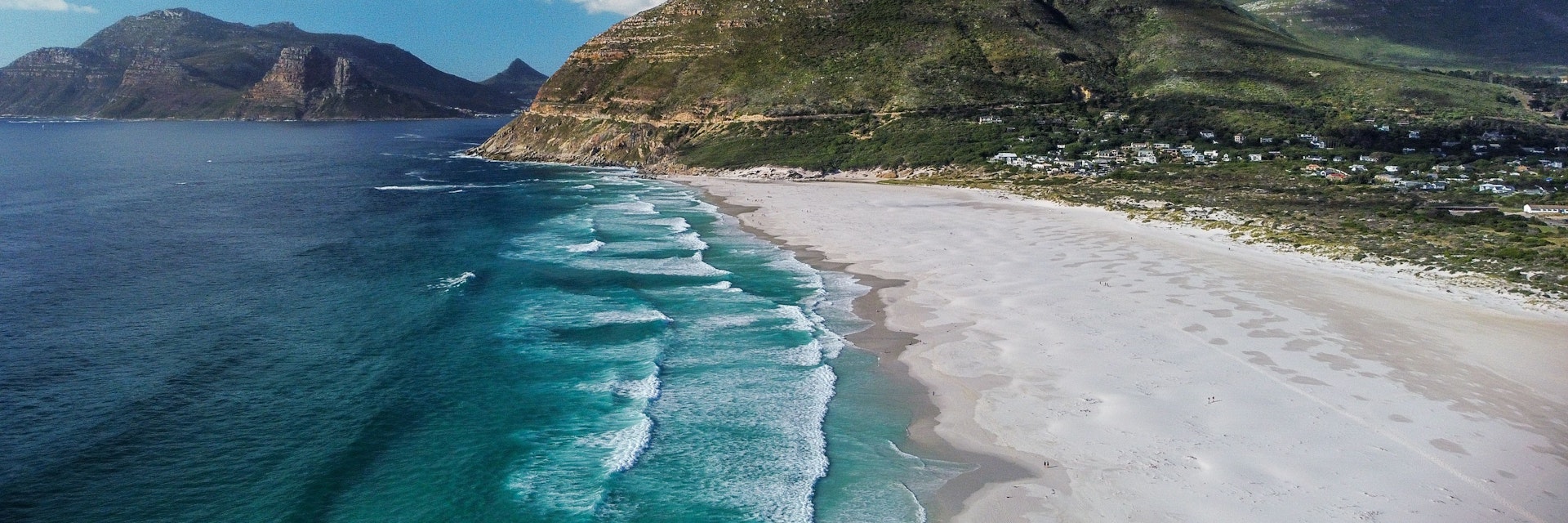 An aerial view of the beautiful Noordhoek Beach and Chapmans Peak in South Africa during summer
1445654367
chapmans peak, coastal, landscape, beautiful, vacation, coast, scenic, background, waves, seaside, outdoor, natural, aerial, top, skies