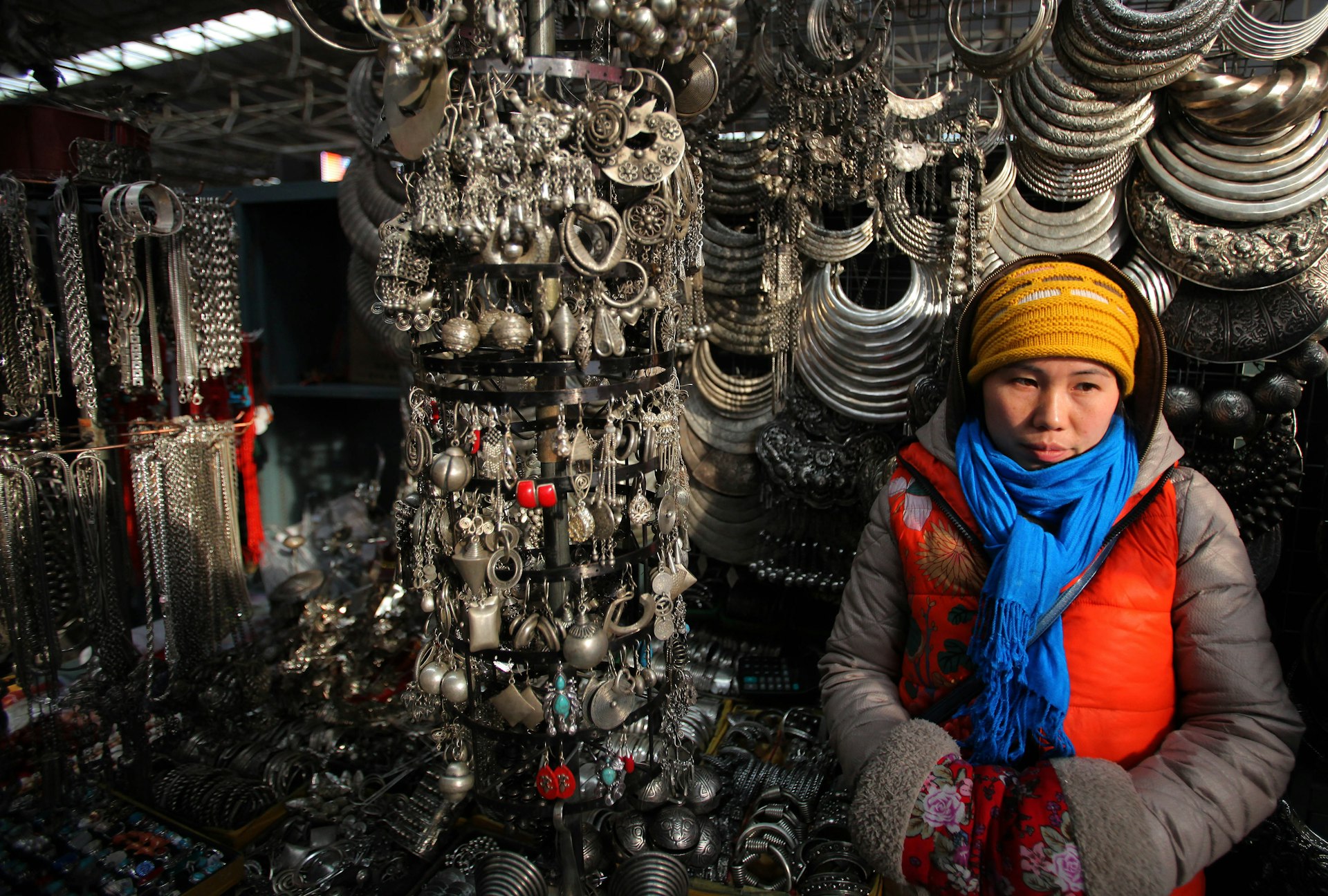 A vendor selling silver and accessories, Panjiayuan Market, Beijing, China