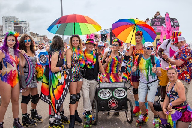 People enjoying the Brighton Pride Parade, Brighton, Sussex, England, United Kingdom