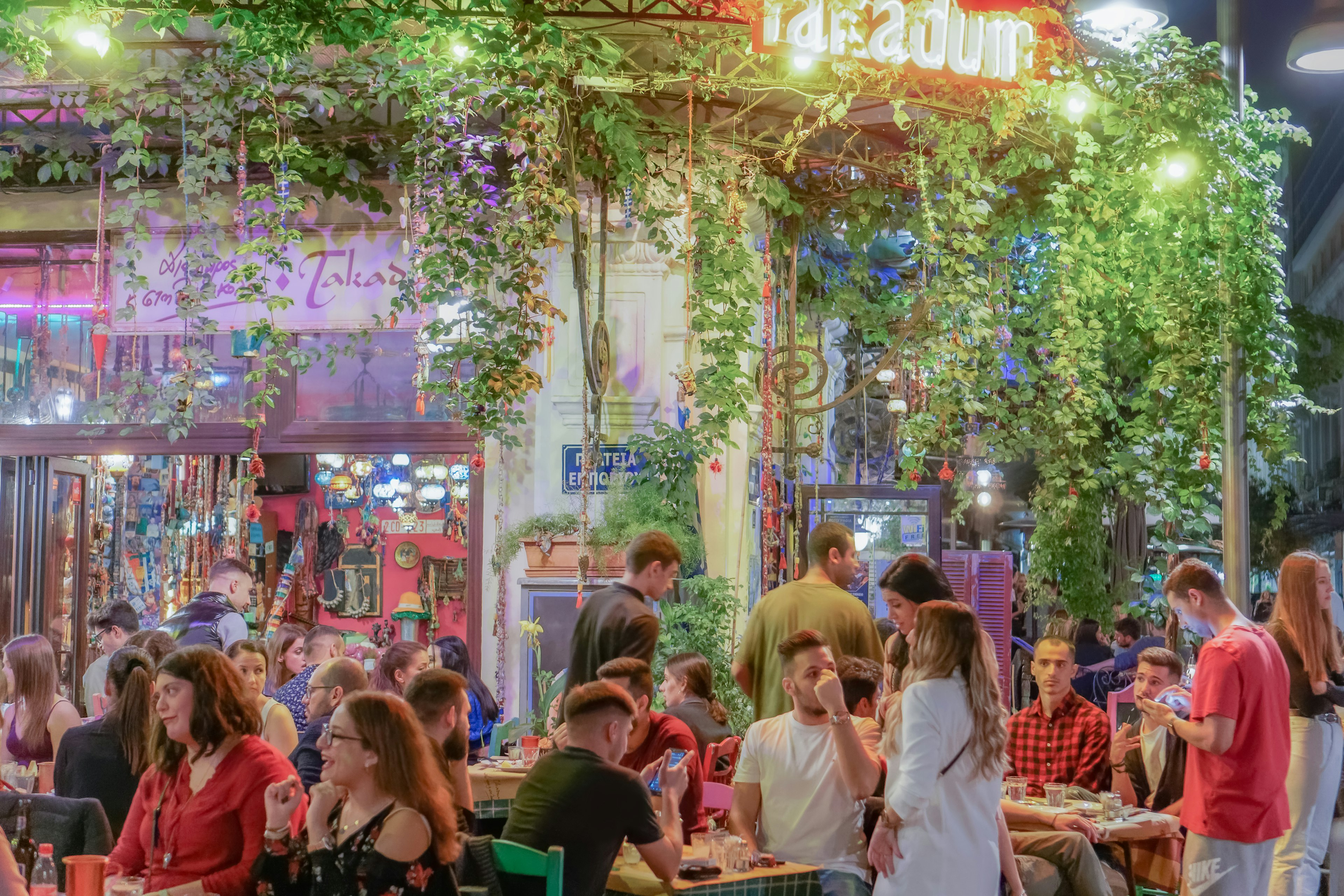 Diners eat at outdoor tables at restaurants in the Ladadika district, Thessaloniki, Macedonia, Greece