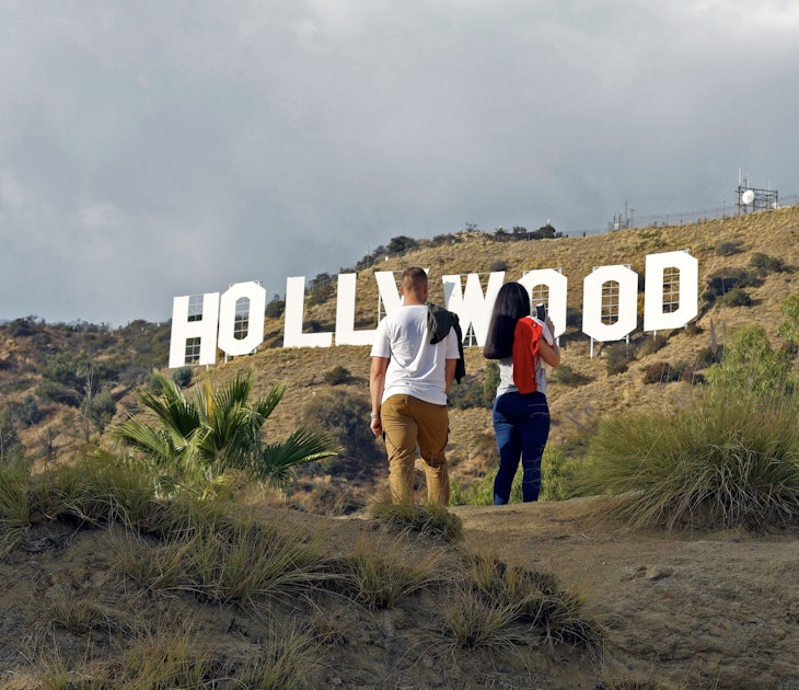Hollywood, California/ USA 11-21-19 Two young people hiking in Hollywood California's Griffith Park stop to admire a famous sign in the Hollywood Hills; Shutterstock ID 1575362842; full: 65050; gl: Lonely Planet Online Editorial; netsuite: Best hikes in LA; your: Brian Healy
1575362842
adventure, america, american, blue, california, destinations, famous, griffith, high, hike, hiking, hill, hills, hillside, hollywood, iconic, la, landmark, landscape, los angeles, monica, mount, mountain, nature, outdoor, park, people, rock, santa, santa monica, sight, sightseeing, sky, summer, tourism, tower, trail, travel, trekking, usa, vacation, view, western, white