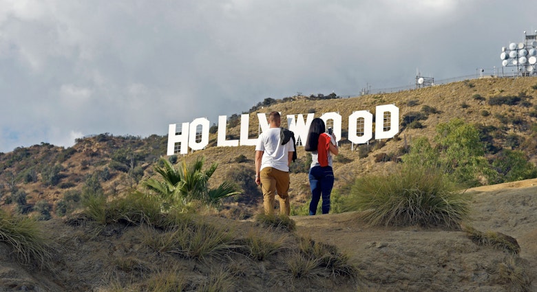 Hollywood, California/ USA 11-21-19 Two young people hiking in Hollywood California's Griffith Park stop to admire a famous sign in the Hollywood Hills; Shutterstock ID 1575362842; full: 65050; gl: Lonely Planet Online Editorial; netsuite: Best hikes in LA; your: Brian Healy
1575362842
adventure, america, american, blue, california, destinations, famous, griffith, high, hike, hiking, hill, hills, hillside, hollywood, iconic, la, landmark, landscape, los angeles, monica, mount, mountain, nature, outdoor, park, people, rock, santa, santa monica, sight, sightseeing, sky, summer, tourism, tower, trail, travel, trekking, usa, vacation, view, western, white