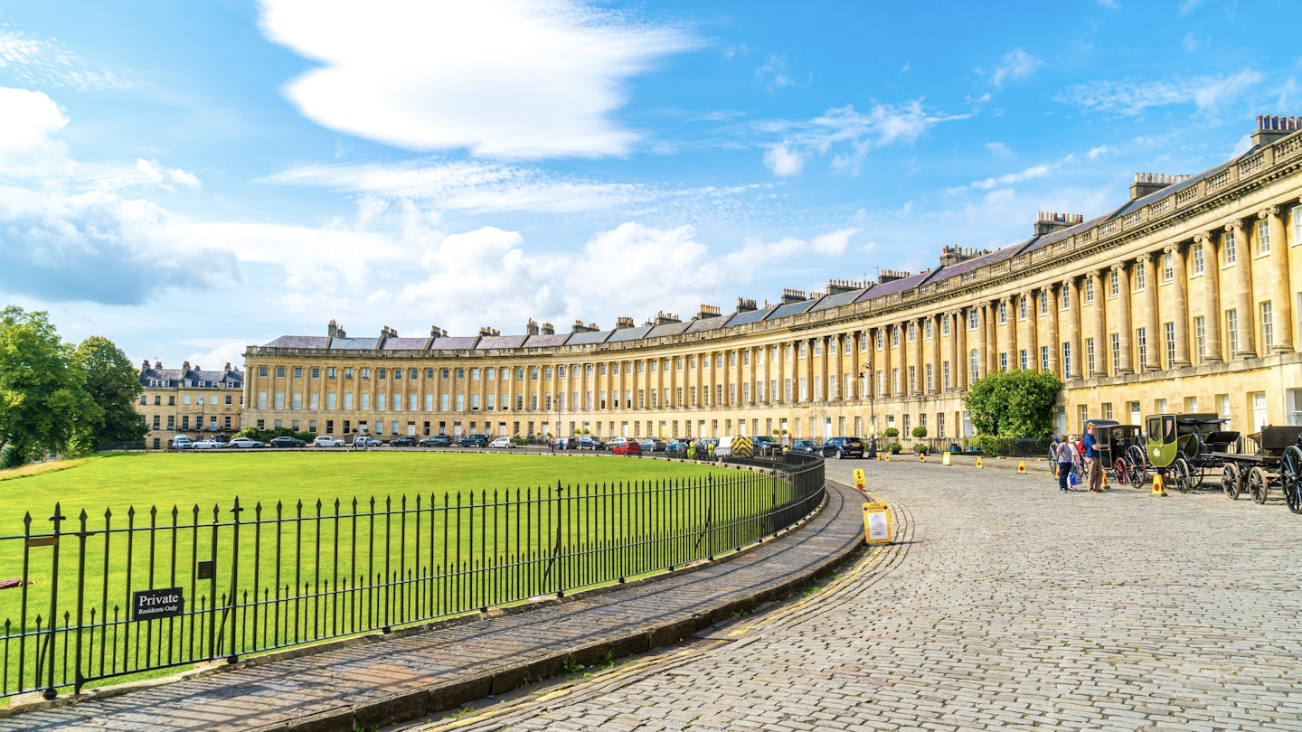 Bath ,England - AUG 30 2019 : The famous Royal Crescent at Bath Somerset England, United Kingdom.; Shutterstock ID 1601122237; full: 65050; gl: Lonely Planet Online Editorial; netsuite: Top 16 places in England; your: Brian Healy
1601122237
ancient, architecture, bath, blue, british, building, city, cityscape, crescent, culture, england, english, europe, european, famous, garden, georgian, georgian architecture, heritage, landmark, old, palladian style, royal, royal crescent, royal crescent bath, sky, somerset, style, summer, terrace, terraced houses, the royal crescent, tourist, touristic, town, townhouses, travel, uk, urban, view