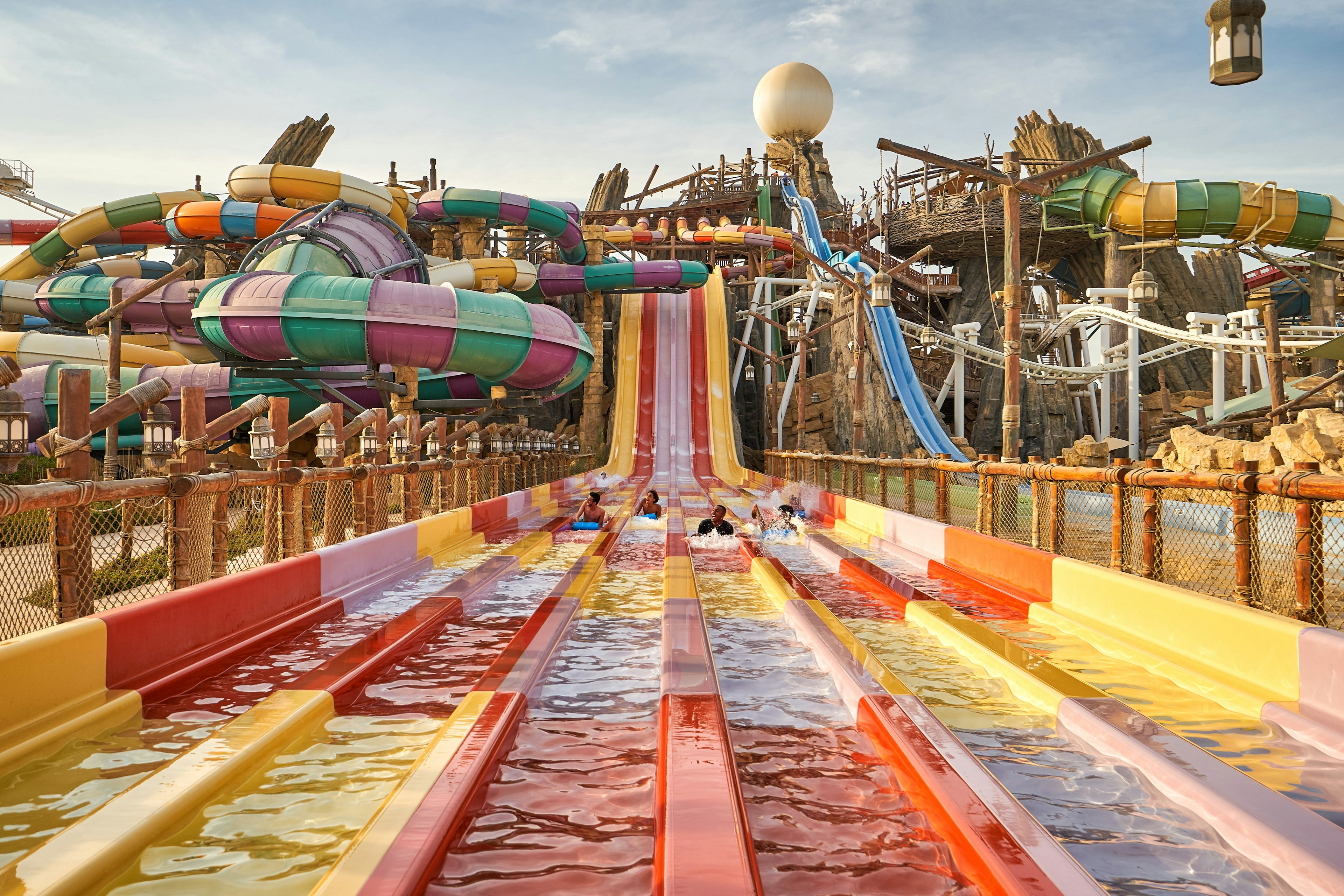 Visitors are zooming down a water slide on their stomachs at Yas Waterworld aquapark in Abu Dhabi