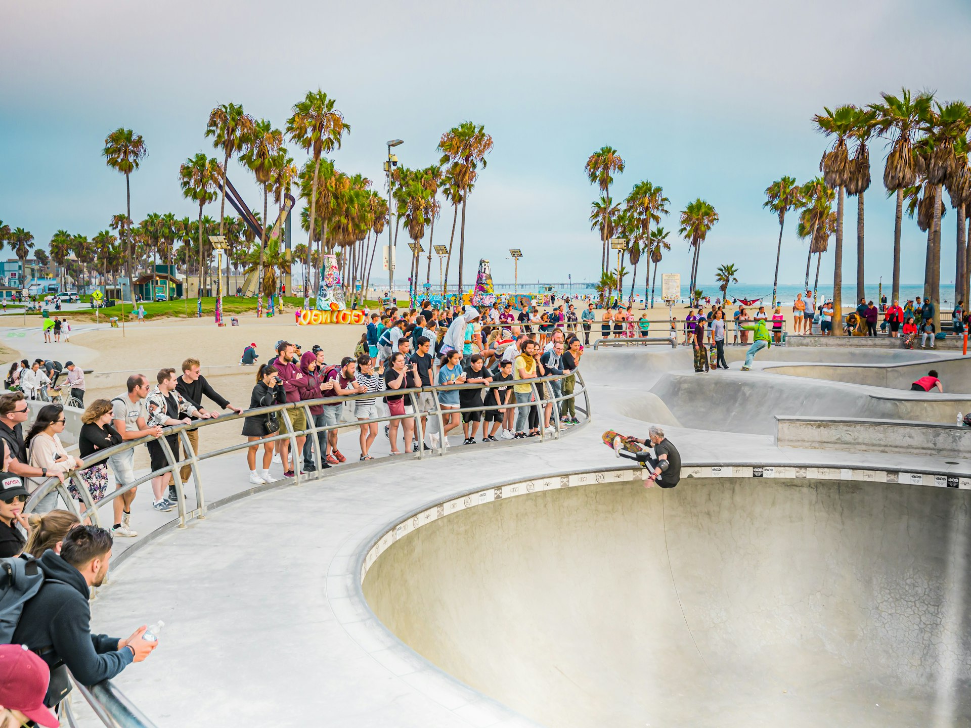 People watch skateboarding at Venice Beach, Los Angeles, California, USA