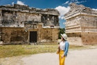 Girl tourist walks through the ancient Mayan complex Chichen Itza.A popular tourist destination in the Yucatan - Chichen Itza complex ; Shutterstock ID 2077363255; purchase_order: 65050; job: Cancun day trips; client: Online ed; other: ClaireN
2077363255