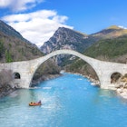 The great arched stone bridge of Plaka on Arachthos river, Tzoumerka, Greece.; Shutterstock ID 2131287987; full: 65050; gl: Lonely Planet Online Editorial; netsuite: Best places to visit in Greece; your: Brian Healy
2131287987
aerial, ancient, arachthos, arahthos, arch, arched, architecture, bridge, canyon, cascade, drone, environment, epiros, epirus, famous, forest, greece, greek, historic, historical, history, ioannina, landscape, medieval, monument, mountain, natural, nature, old, park, pindos, pindus, plaka, rafting, river, rock, scenery, scenic, stone, stream, structure, traditional, travel, tree, tzoumerka, vacation, water, waterfall, wild