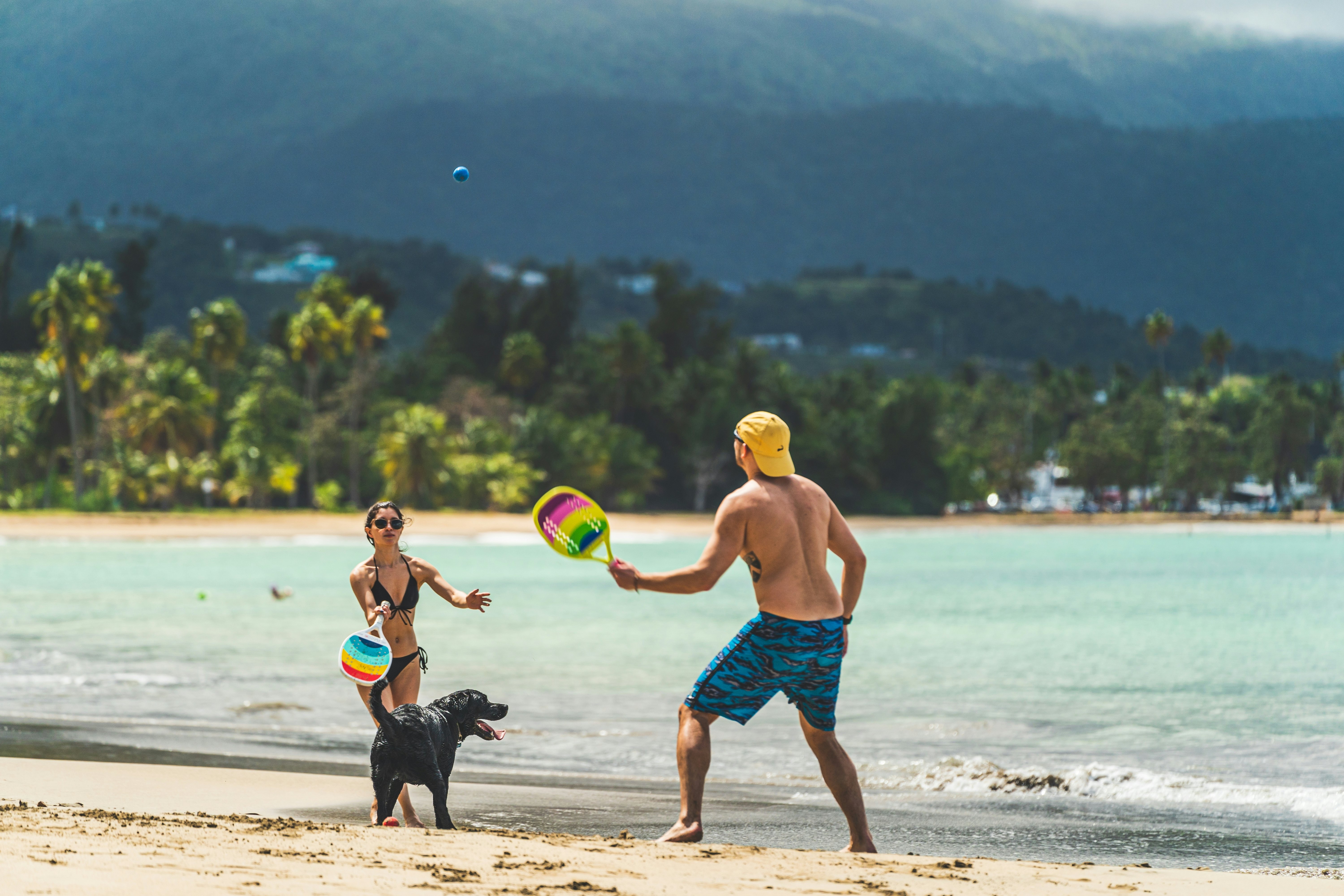 A couple plays on the beach in Luquillo, Puerto Rico