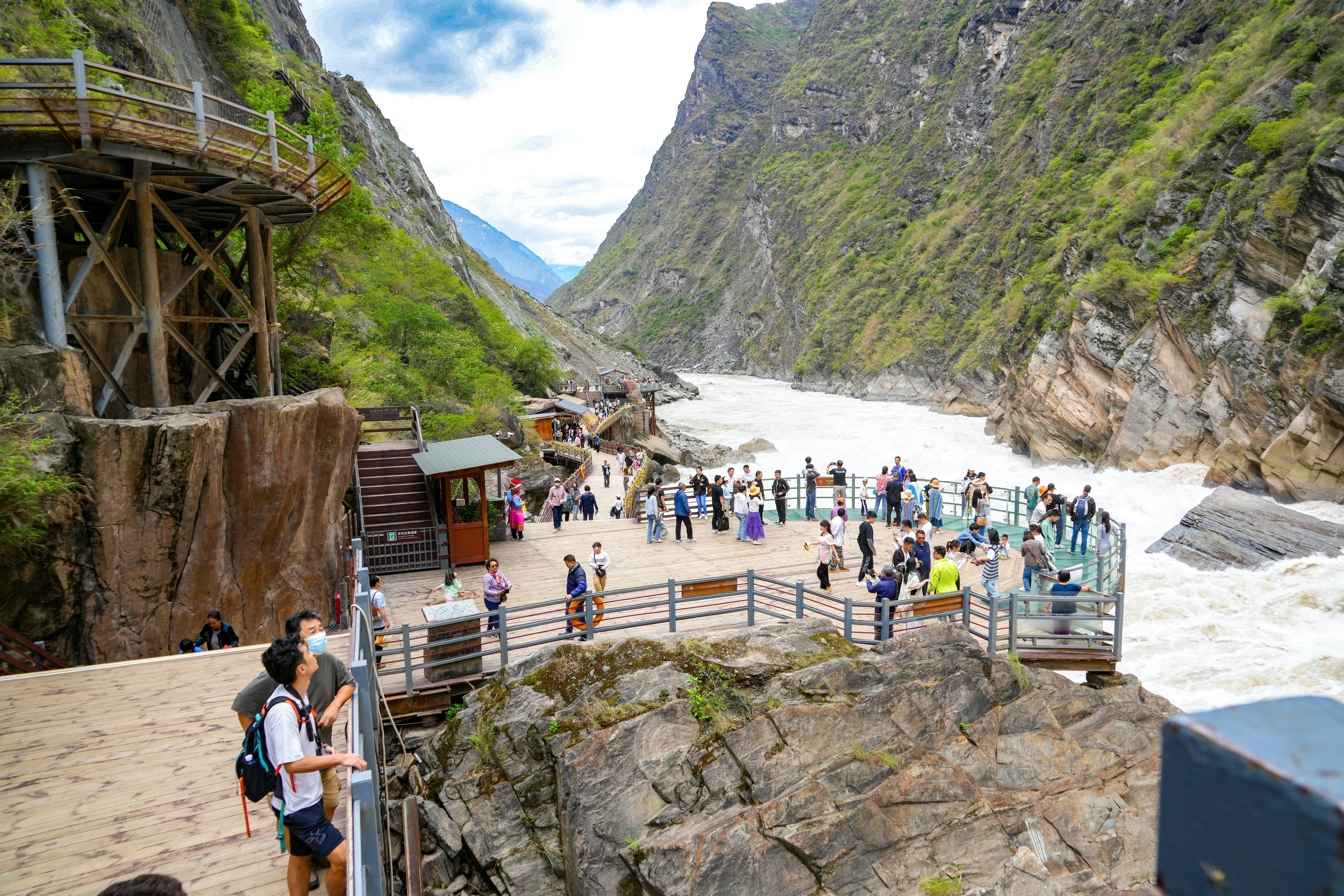 Tourists on a viewing platform at Tiger Leaping Gorge, Yunnan